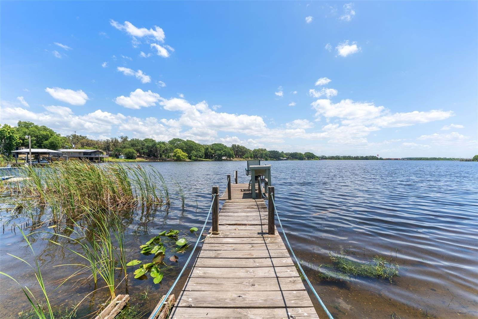 Presenting a buildable lot for sale on beautiful Lake Agnes! Offering a lifetime of beautiful sunrises from your future back porch. This ideal future lake house getaway is perfect for the fishing and boating enthusiasts. Nothing but opportunity here!!  This spacious 70ft by 230ft (.39 acre) lot can be sold individually or in conjunction with the adjacent lot for a total of .77 Acres. The adjacent lot is MLS#TB8403006 . There is a single wide on the property that will convey with the sale. The property currently has city water and electric in place. No survey is available from the seller at this time. X and AE flood zones. Conveniently located near Fantasy of Flight and easy access to I-4 Tampa or Orlando, this future home site offers a balanced blending of tranquility yet accessibility to local attractions.