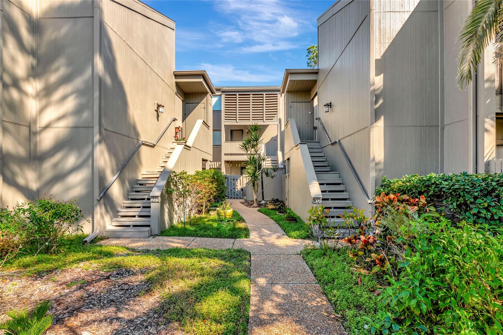 Tucked away in the charming community of Pine Run, this uniquely designed two-story condo offers the perfect blend of privacy, comfort, and Florida lifestyle living in the heart of Osprey. This spacious 2-bedroom, 2-bath residence features a layout offering the primary suite on the first floor—ideal for ease of living and added privacy. The main level offers an inviting living and dining area filled with natural light, creating a warm and welcoming space for both relaxing and entertaining. The primary bedroom retreat provides generous space, ample closet storage, and a well-appointed en-suite bath. Upstairs, you’ll find a loft that is designed to be the second bedroom and full bath, perfect for guests, a home office, or seasonal visitors. The two-story design enhances privacy while maintaining an open and airy feel throughout. Pine Run is truly a hidden gem, known for its lush, mature landscaping and tranquil setting. Residents enjoy a peaceful, maintenance-free lifestyle just minutes from Gulf beaches, waterfront dining, shopping, and the cultural attractions of Sarasota. Whether you’re searching for a full-time residence or a seasonal retreat, this condo offers the ideal combination of comfort, location, and relaxed coastal living.