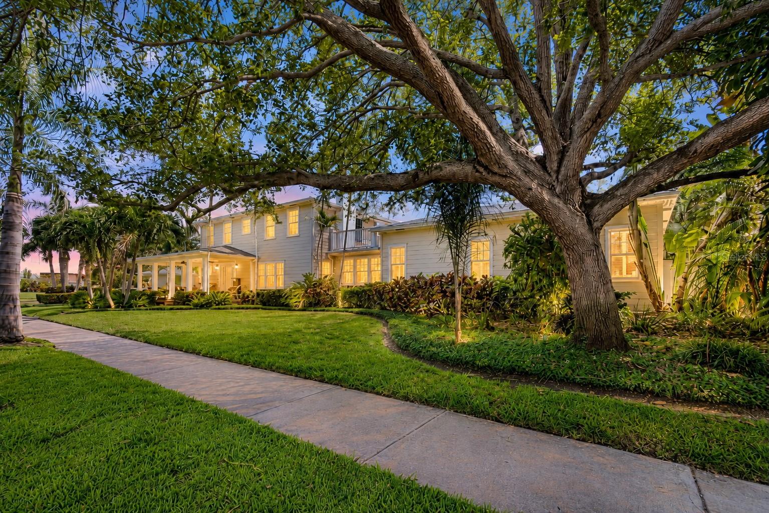 Located in the heart of historic Old Northeast and one block from scenic Coffee Pot Bayou; this exceptional estate home offers the perfect blend of classic character and elevated Florida living.  Situated on a rare double corner lot with lush mature landscaping, the home welcomes you with an inviting front porch.   Just inside, a large foyer and formal living room start the classic flow off right.  The heart of the home, a large custom kitchen with artfully inspired island features a dual fuel Wolf range, SubZero refrigerator and built-in buffet/bar plus informal living and dining space to create a comfortable hub for everyday living.   
The backyard delivers something genuinely unique and special for Old Northeast.  A covered outdoor living area with a gas fireplace sets the mood for cool evenings. The outdoor kitchen includes built-in grill and generous serving counter stand ready for everything from a casual Sunday cookout to a full celebration. A sparkling saltwater pool shimmers at the center of it all, with additional deck space surrounding it, equally suited to a quiet night in or a party that spills well past sundown. 
The first-floor primary suite is private, spacious, and finished to a standard in keeping with the rest of the home.  Italian marble, a seamless glass shower, a Jacuzzi tub, and double vanity define the spa-inspired bath. Soaring ceilings, a small living room and large walk-in closet complete the retreat-like space.  
Three bedrooms plus bonus room upstairs - potentially a fourth upstairs bedroom -  are spacious and bright; two rooms feature a balcony overlooking the pool or yard.      A downstairs home office and laundry room complete the interior.    Schedule a showing today!
