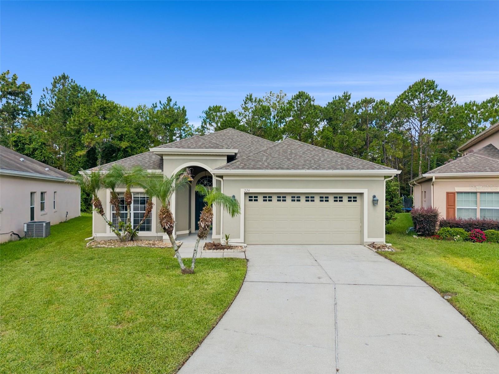 *0.21 acres* Newer flooring in 2023* Roof 2023* Conservation View* Cul-De-Sac* Welcome home to the beautiful Woodland Lakes II gated community! As you approach the house, you will notice the small sitting area in the cul-de-sac.  Walking through the front entry, you encounter the formal dining room to your right. To the left you will see bedrooms two and three separated by the second bathroom, which also serves as the guest bathroom. This bathroom boasts a double sink paired with a combined tub and shower. Continuing forward you will walk into the large living room, with the kitchen to your right. The kitchen contains stainless steel appliances, oak cabinets, and a nice sized pantry. The laundry room to the right is a great landing point as an entrance from the garage. Just past the living room you will find the primary bedroom with beautiful brand new vinyl flooring. The en suite bathroom contains separate vanities, as well as a shower and walk-in tub. Looking beyond the living room and kitchen is the back porch that has been pressure washed. This screened in spacious area is perfect for sitting with a cup of coffee on a quiet morning listening to the sounds of nature that surround you. The Woodland Lakes community features incredibly well maintained common areas, including secure gate access, swimming pool, jacuzzi, and a playground with a BBQ area. The community has easy access to Highways 408 & 417 which allows convenient travel to Central Florida & beyond. Call NOW to view this home!