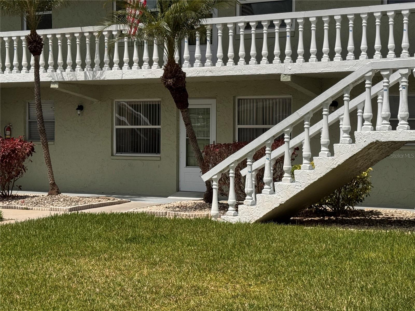 Charming Ground-Floor Florida Retreat in the Active 55+ Green Dolphin Community! | Welcome home to this bright, move-in ready 1-bedroom, 1-bathroom ground-floor condo located in the heart of Tarpon Springs. Offering a perfect blend of low-maintenance living and resort-style amenities, this unit delivers the ultimate Florida lifestyle. | Interior Highlights:Open & Airy Layout: Features a fantastic kitchen/family room combo with warm laminate wood flooring flowing seamlessly throughout the main living areas.  Functional Kitchen: Enjoy a comfortable cooking space featuring an inviting breakfast bar pass-through, ample cabinetry, a double basin sink, and full-size appliances.  Built-in Versatility: The main living area includes a custom built-in Murphy bed flanked by beautiful cabinetry and shelving—perfect for maximizing your square footage or effortlessly hosting overnight guests.  Spacious Primary Suite: Offers a generously sized bedroom with a large closet, ceiling fan, and classic vertical blinds.  Updated Bathroom: Designed for ease and peace of mind, the full bath features tile flooring, a vanity with granite-style countertops, a tub/shower combo with sliding glass doors, and accessibility grab bars.  | Resort-Style Community & Outdoor Living:
Step outside your front door to a beautifully manicured, tree-lined courtyard that leads directly to a wealth of community amenities. Residents enjoy access to a sparkling community pool, tennis courts, shuffleboard courts with covered seating, a fully equipped fitness center, and a vibrant clubhouse with active social calendars.  Unbeatable Value:
The monthly HOA fee (lowest in the community) covers an incredible list of utilities and services, making this unit exceptionally budget-friendly. Your fee includes cable TV, high-speed internet, water, sewer, trash, exterior maintenance, ground care, pool maintenance, and escrow reserves!  | Conveniently located near public transit, paved sidewalks, and local shopping, this condo is ideal as a year-round residence, a seasonal winter retreat, or a long-term investment property.  | Schedule your showing today and start enjoying the best of 55+ resort living!