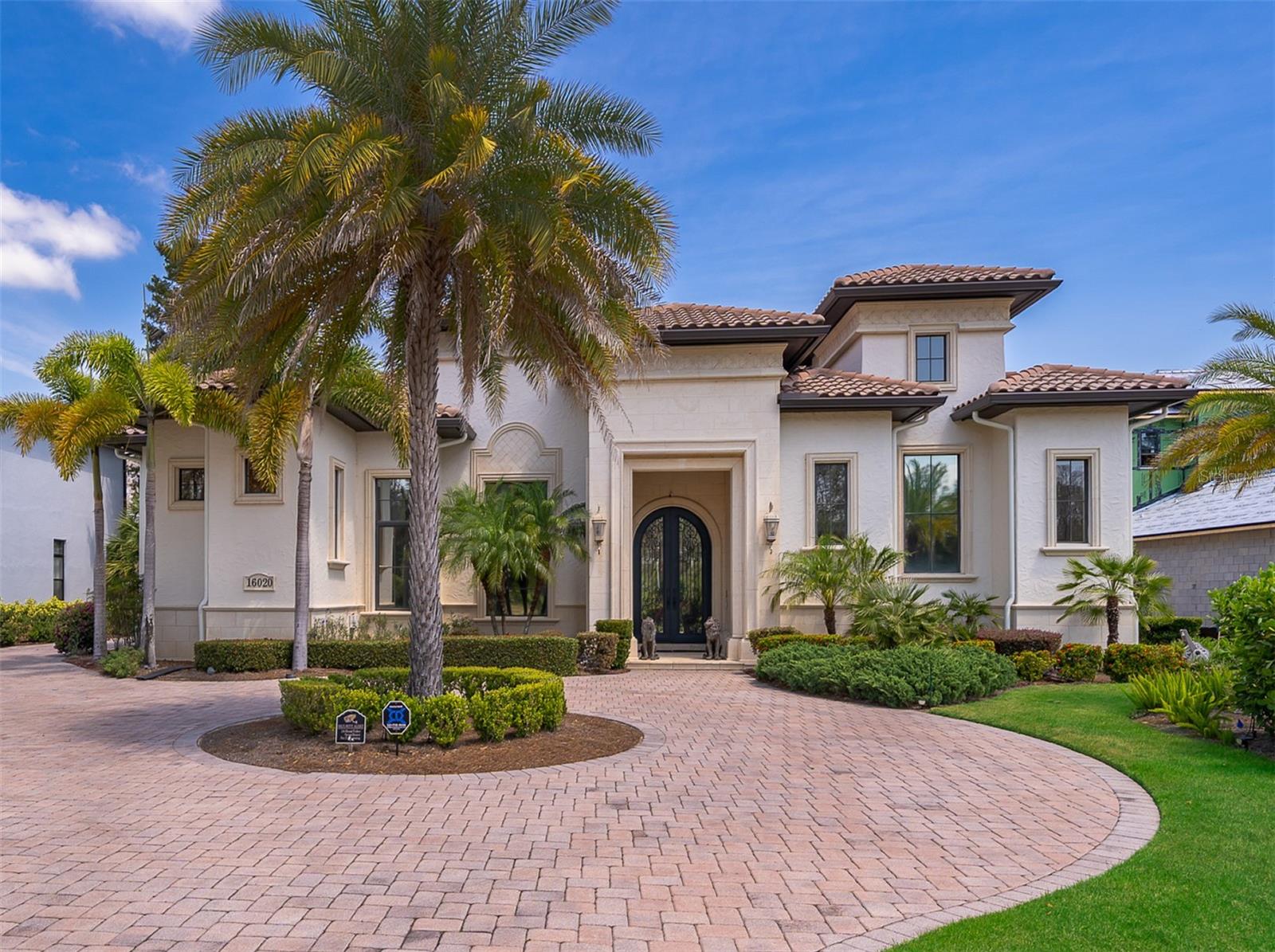 For Sale: Stunning 4,978 Sq Ft (Heated), 8,116 Sq Ft (Total) Estate in Bella Collina with Expansive Outdoor Living and Smart Features

Welcome to luxury living in the exclusive, guard-gated community of Bella Collina. This spectacular custom estate offers 5 bedrooms, 5 full bathrooms, a private home office/study with built-in wall units, and a flexible bonus/media room—all designed with open architecture and soaring 16’ architectural ceilings throughout. The heart of the home is a gourmet chef’s kitchen outfitted with Busby cabinets, Wolf double ovens and microwave, Sub-Zero refrigerator, and a 2024 Miele dishwasher. The bar area includes a mini fridge, wine fridge, and a separate ice maker for effortless entertaining. The master suite also features a mini fridge for added convenience. Step through the sliding glass doors into a breathtaking ~2,200 sq ft covered outdoor living area, complete with a gourmet outdoor kitchen, mini fridge, ice maker, and a gas fireplace—all within a beautifully columned lanai that overlooks the pool area and captures incredible sunset views. Recent upgrades include: New air conditioning (Sept. 2023), WiFi-enabled tankless water heater (2022), Nest and Lennox smart HVAC system, Speakers throughout the home, and Alarm system. A spacious side-entry 3-car garage is conveniently located at the rear of the home, adding to the clean architectural curb appeal. This home perfectly balances high-end finishes, technology, and elegant indoor/outdoor flow—set within the serene, amenity-rich setting of Bella Collina, featuring a Nick Faldo Championship golf course, spa, clubhouse, and lake views. Don’t miss the opportunity to own this one-of-a-kind luxury retreat in Central Florida’s premier private community.