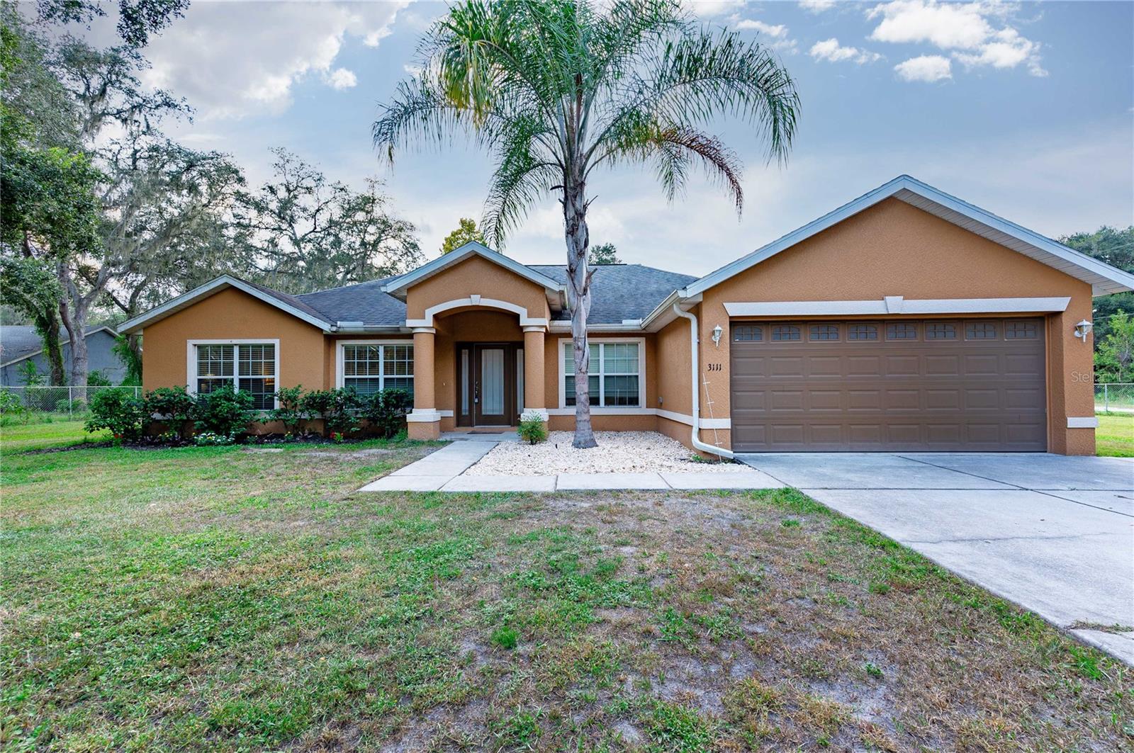 Built in 2017, this sprawling 4 bedroom, 3 bath home is the perfect place to bring your animals and bring
your toys! Set on 2.44 fenced acres, this property offers a two-stall horse barn, a tack room, a hay room, a
separately fenced paddock, an above-ground pool with a deck, a hot tub, and an expansive home
designed for flexibility and entertaining. Inside, the formal living room seamlessly flows to the dedicated
dining room. The family room feels spacious and inviting with high ceilings and views of the nicely
appointed kitchen that features granite countertops, breakfast bar seating, a central island, an eat-in
dinette, a pantry, and stainless steel appliances, including a double oven! Privately located on the south
side of the house, the primary suite offers plush carpet flooring, two walk-in closets, and an ensuite
bathroom with a deep soaking tub, a walk-in shower, and a dual sink vanity. Bedrooms 2-4 are on the
opposite side of the house, adjacent to both full guest bathrooms. An indoor laundry room, plenty of
storage closets, a gated, extended driveway, and a 2-car garage add to the home's allure. Relax at the
end of a long day on the screened, covered Lanai. Gaze at the stars from the hot tub, take a dip in the
pool, or enjoy a rural lifestyle with farm animals! The possibilities are endless at this turn-key property. It is
centrally located in Zephyrhills, close to local restaurants, medical facilities, shopping centers, and more. There is an additional 2+ acres adjacent to this property, the Sellers are willing to sell with this home.  Give us a call today for your private showing!