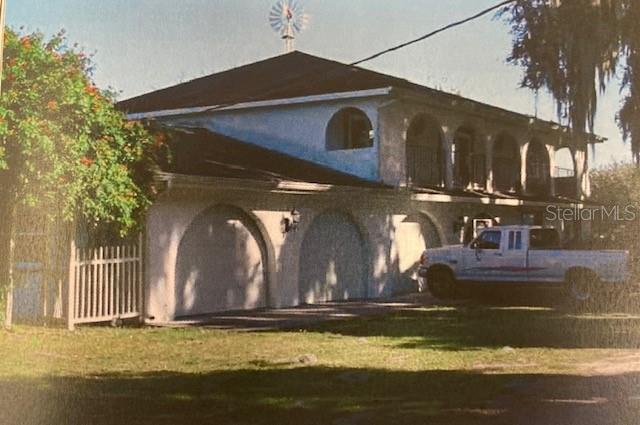 YOU FOUND IT!  HUGE OPPORTUNITY to build your FAMILY COMPOUND! 4-bedroom, 2 1/2 bath single-family home situated on 20+ acres!  The home has passed a 4-point inspection. The primary bedroom is huge with a nice bath, a jacuzzi tub, and a separate shower, a 10x20 screened covered porch off the master looking over the pasture and pond, the additional (3) Bedrooms have French doors leading to a huge, continuous, covered porch that runs the entire front of the house. Downstairs is a half bath, perfect for guests. Pecky cypress, gorgeous wood-walled brick floor, family room. Eat in the kitchen area. Open-concept dining room and living room, BEAUTIFUL brick fireplace. Inside access to a 3-car attached garage. Covered porch off the dining room. Laundry room off the kitchen. Enjoy your time outside in your screened lanai or host a huge party and cookout on your expansive acreage. Bring your cows, horses, goats, chickens, and ducks! Horse boarding is available! BONUS EQUIPMENT: (19) 12x12 Stalls, Concrete center aisle, Fly spray system, Hot cold wash rack, Covered open porch, Feed room, Tack room with Bathroom. 10-acre pasture w/ 1 acre natural pond (drinkable horse water), (4) individual pastures (approx. 1 acre each). THE GRASS IS AWESOME with Water lines, 80 ft solid round pen (steel base of a grain silo). HUGE 80 x 80 Metal/Shop building. 

Also features TWO MOBILE HOMES: 3 Beds | 3 Bath single wide, with a fenced yard, separate driveway from main house. Very private: a 3bdr 3bthrm double-wide, very well kept. Currently, both mobile homes are tenant-occupied (great-paying tenants). The well, septic, and drainfield have been updated for each home on the premises. The value is in the land! Best of all, you are only minutes away from major shopping areas and interstates, making it easy to get wherever you need to go! For more info see MLS#TB8472229