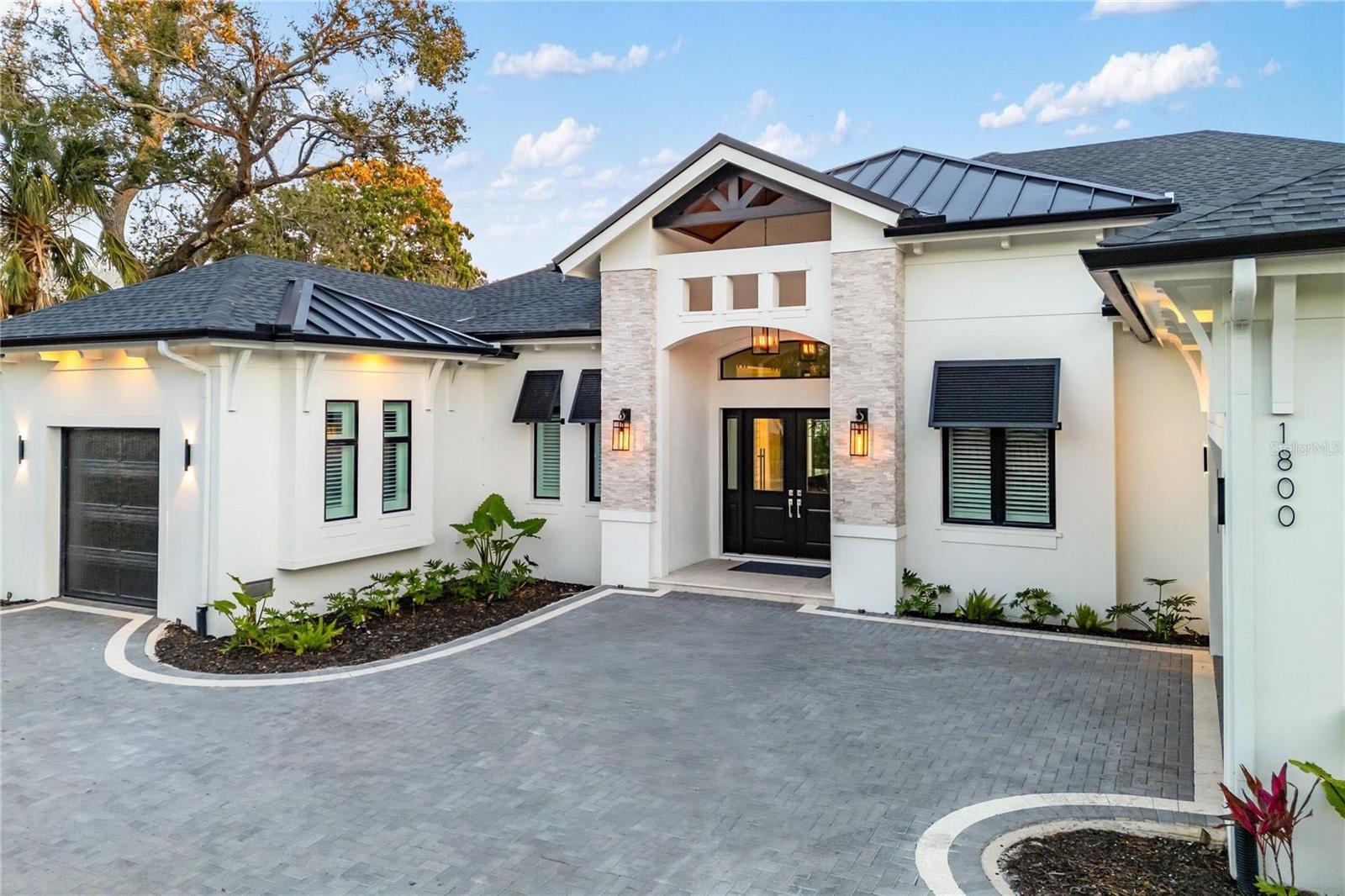 Nestled in the heart of West of the Trail, this luxury single-story estate represents the pinnacle of modern living. Encompassing 3,262 square feet, the home features 4 bedrooms, 4 full bathrooms, and 2 half baths, all thoughtfully designed for both comfort and functionality. Set on an expansive 15,930-square-foot lot, the residence offers tranquility just moments from the shops and dining of Southside Village. Enjoy the convenience of a circular driveway with a custom paver design and garage space for three cars. With striking architecture, impeccable craftsmanship, and beautiful, thoughtfully curated finishings—showcasing detailed trim work and refined design throughout—this residence delivers sophistication and all-inclusive resort-style living in one of the area’s most desirable locations.

Inside, soaring 18-foot vaulted ceilings and custom tray ceilings enhance the open-concept layout, while 12-foot full pocket sliders seamlessly connect indoor and outdoor living spaces. The living room is anchored by a sleek fireplace, creating a warm yet modern focal point. The chef’s kitchen is equipped with professional-grade gas appliances, a waterfall-edge quartz island, custom cabinetry, and an expansive butler’s pantry for effortless entertaining. A glass-enclosed wine display and tray ceiling details add dramatic appeal. The primary suite features 14-foot ceilings and a spa-inspired bath with a freestanding soaking tub, dual vanities, and a luxurious walk-in shower. All bedrooms include custom California Closets. A designated large office, spacious laundry room, and private gym complete the interior amenities. The home also has a full security system installed.

Outdoors, the resort-style backyard showcases a heated saltwater pool and hot tub spa with elegant water features. The back patio, finished with a Brazilian hardwood ceiling, is enhanced with remote-controlled mosquito blinds with sun protection for year-round comfort, as well as a full sound system that can be app controlled. A fully equipped outdoor kitchen, fire pit, and outdoor SunBrite TV create the ultimate entertaining space, while a private putt-putt golf course adds a one-of-a-kind touch to this exceptional property.

Please let us know how we can help and give us a call to set up a tour of this beautiful home. Thank you.