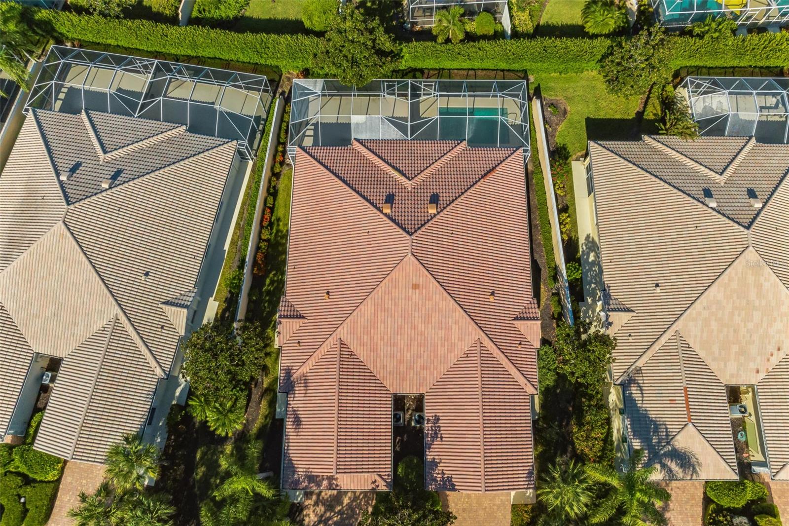 Extended Capri III Villa in the Resort Style community of VillageWalk.  2 Bedroom, 2 Bath + Den, 2 Car Garage.  Beautiful Vaulted ceilings, built in wall unit and tile floors / carpet throughout. Open kitchen, white cabinetry and polished granite countertops.  The master bedroom has a walk-in closet with built in organizers and a master bathroom with dual sinks, linen closet and walk in shower.  The guest bedroom has a walk in closet and full bath ensuite. Covered Lanai with private view of greenery and open sky.  The laundry room has  cabinets for storage and utility sink.  Divosta construction includes top quality: poured concrete forms and reinforced construction.  Enjoy Town Center where there is a restaurant with full bar, hair salon, boutique, gas station.  Clubhouse includes state of the art fitness center, library, meeting rooms and event space.  Resort Pool, lap pool, 6 6tennis courts, pickleball, bocce ball, basketball courts and miles of walking paths/trails.  A true natural paradise..  Convenient to New Publix, Costco, Legacy bike Trail, Siesta Key Beach, shopping dining, and more.  Call Today to see this great home!