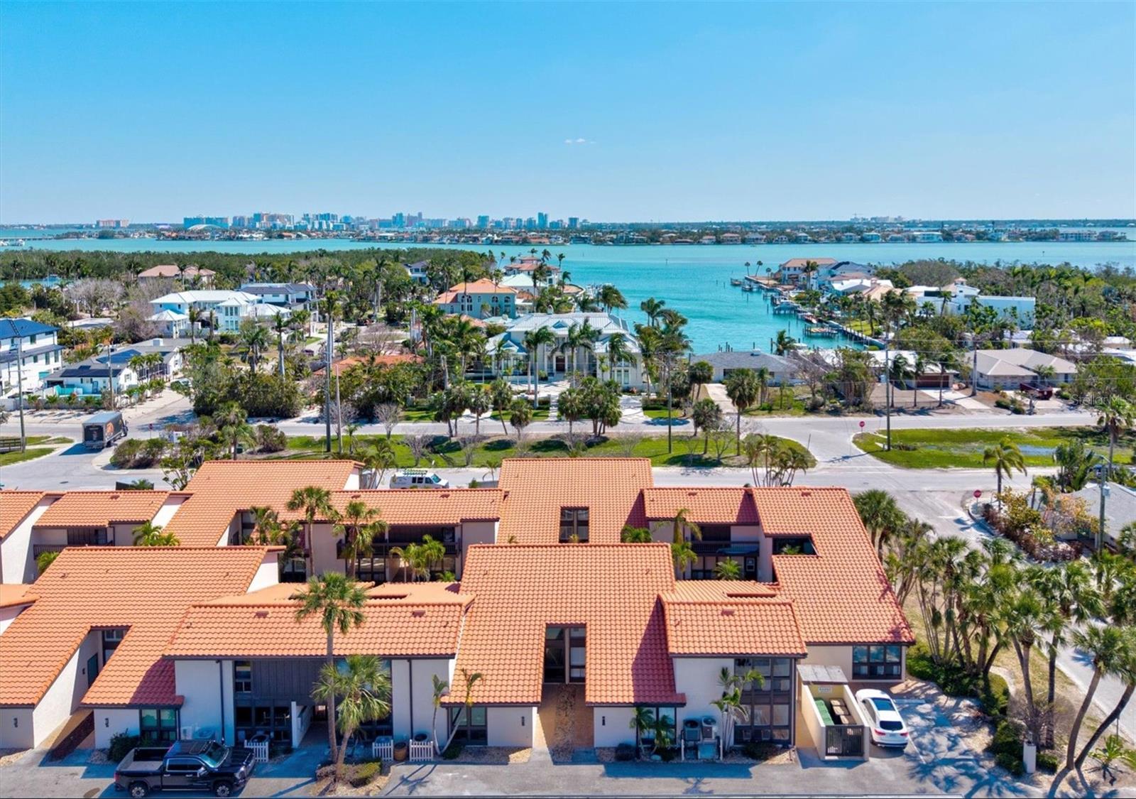Welcome to Embassy Villas – Your Island Getaway on Lido Key! This home is being offered fully furnished and turnkey, making this home not only beautiful but truly move-in ready. Drop your luggage and enjoy! You're Home!!

Experience the ultimate coastal lifestyle in this beautifully renovated unit, ideally situated just two blocks from the pristine sands of Lido Beach. With a prime location and two-week minimum rentals allowed, this is the perfect retreat for a seasonal escape or a savvy investment opportunity.

Step inside to discover a stylish, contemporary townhome featuring vaulted ceilings, large windows, and an open, light-filled layout and a first-floor primary bedroom. This home has just undergone an extensive renovation, including luxury vinyl plank flooring on the first floor, fresh paint throughout, a fully updated kitchen with brand-new cabinetry, quartz countertops, and all new stainless-steel appliances. The first-floor bathroom has also been completely renovated with a new vanity, new shower, new toilet, and a modern light-up mirror. Upstairs, you'll find brand-new carpeting and a spacious guest suite with a full bath.

Enjoy peace of mind with major upgrades, including a new AC system, new water heater, and new washer and dryer. The condo also has plantation shutters throughout.

Enjoy world-class shopping, dining, and entertainment at St. Armands Circle, or head to Lido Beach for sunbathing, swimming, or relaxing under the shade gazebos. The beach offers food and drink concessions, picnic areas, restrooms, showers, and access to the Lido Beach Public Pool.

Nature lovers will appreciate being just blocks from Lido Nature Park, where you can kayak, fish, or explore the serene mangroves and native birdlife of Sarasota Bay.

All of this is just minutes from Downtown Sarasota, home to cultural gems like the Selby Botanical Gardens, Sarasota Opera House, Ringling Museum, theaters, galleries, and award-winning restaurants.

Embassy Villas combines location, luxury, and lifestyle – don’t miss your chance to own a slice of paradise!