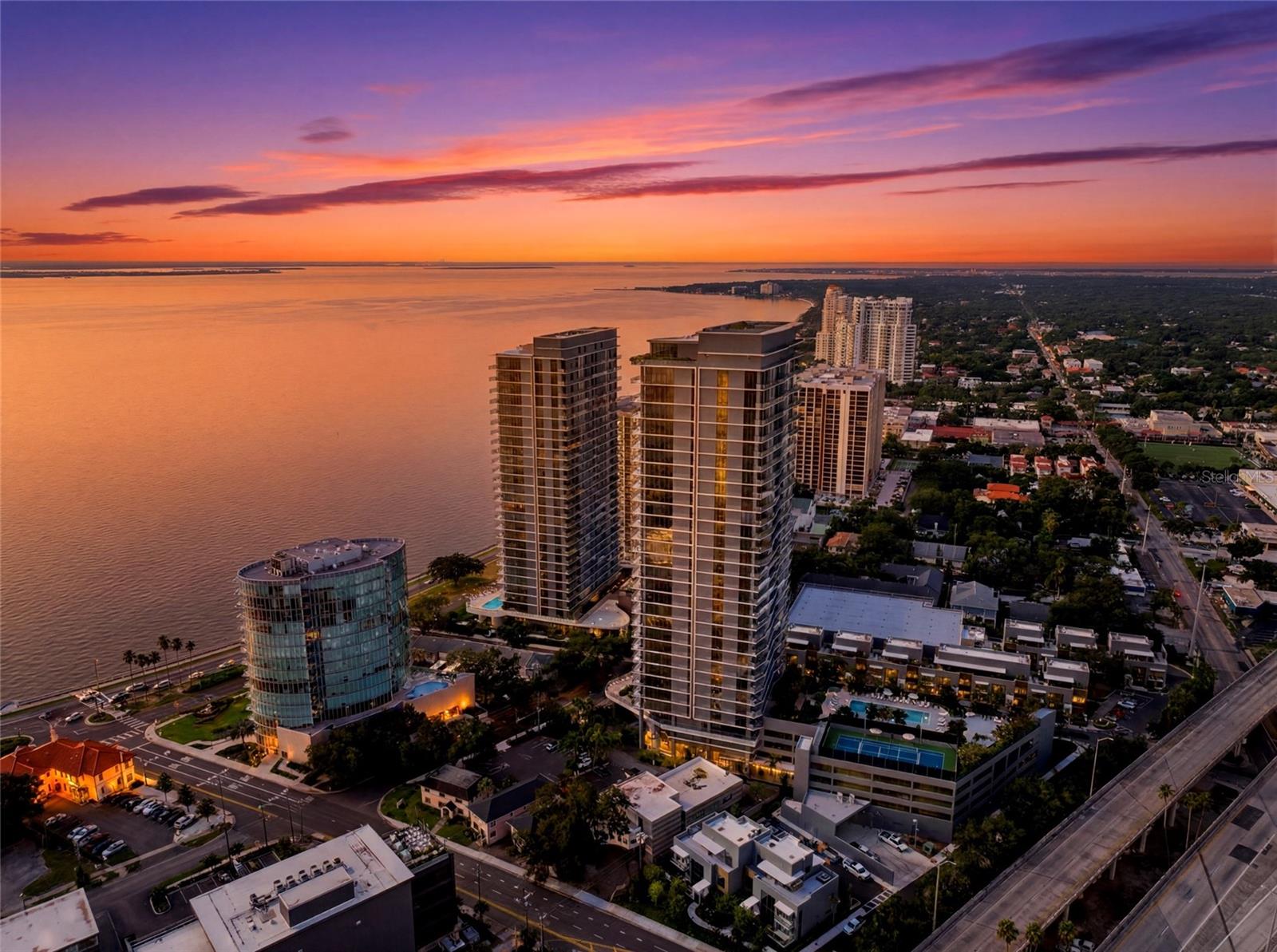 Experience elevated waterfront living at its finest in this exceptional 2-bedroom, 2.5-bath residence at the Ritz-Carlton Residences, Tampa. Perfectly positioned to capture breathtaking panoramic views of Tampa Bay and the iconic Bayshore Boulevard, this home seamlessly blends timeless elegance with modern luxury. Floor-to-ceiling windows bathe the open-concept living spaces in natural light while framing spectacular sunrise and sunset vistas. The chef-inspired kitchen features premium appliances, custom cabinetry, and an oversized island designed for both everyday living and effortless entertaining. The spacious primary suite offers a private sanctuary with spa-inspired bath, generous custom California Closet's, and stunning water views, while the guest suite provides refined comfort and privacy.
Residents enjoy an unmatched collection of world-class amenities, including the spectacular seventh-floor resort-style pool overlooking the bay, private cabanas, state-of-the-art fitness center, elegant owners’ lounge, spa facilities, valet parking, concierge services, and the legendary Ritz-Carlton hospitality that defines luxury living.Located along Tampa’s coveted waterfront, just moments from fine dining, shopping, downtown Tampa, Water Street, Hyde Park, and the scenic Bayshore Boulevard, this extraordinary residence offers an unparalleled lifestyle in one of the city’s most exclusive addresses. Welcome home to effortless luxury, impeccable service, and spectacular waterfront living.