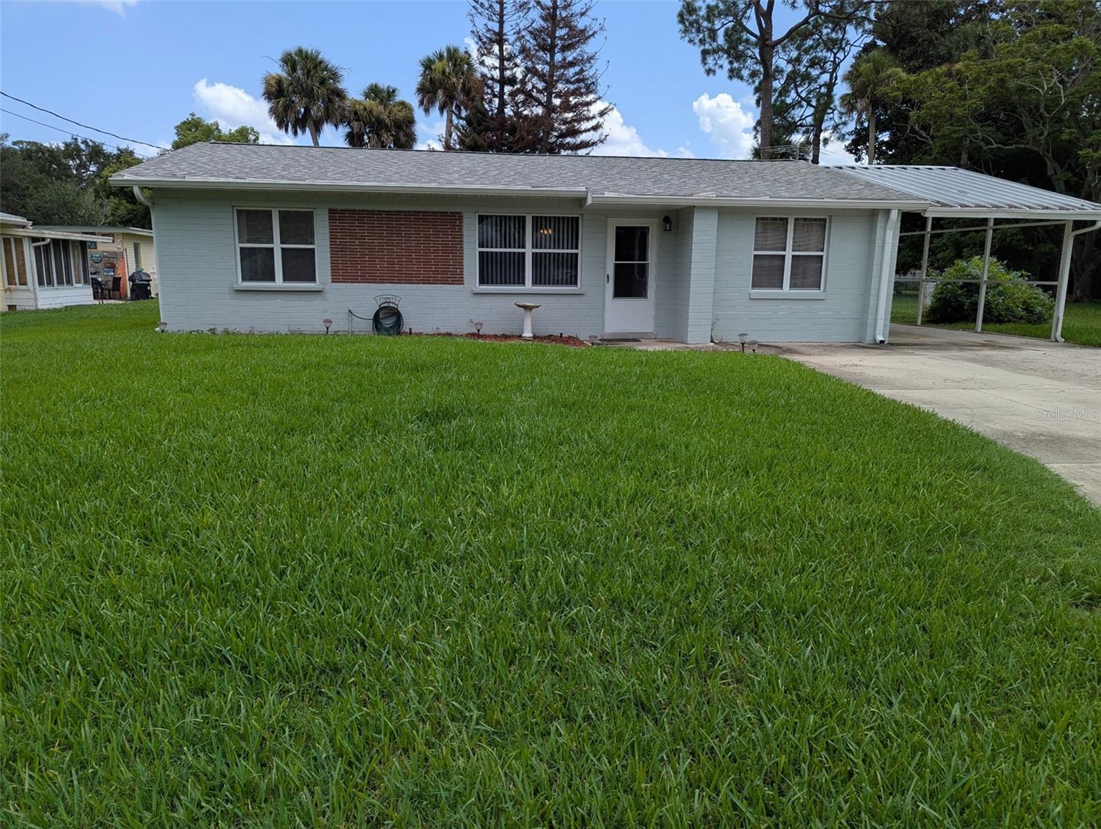 The owner raised her family in this well-constructed home, and now it is time for a new family to call this 3-bedroom, 2-bath residence their own. Step inside to discover a bright and airy living/dining area that welcomes you home. Kitchen has separate area for washer and dryer.
A very spacious Family Room leads out to a screen porch. The Bedroom split plan offers privacy. Note that the Primary Bedroom has a window A/C unit, no A/C duct. The Garage has been converted into a Craft Room but there is a large carport and extra wide driveway for your vehicles. The back yard is completely fenced and has 2 storage sheds at the back of the property. New roof in 2024, irrigation and well in 2023. Water heater in 2019. Located in a quiet neighborhood. Home has never flooded, there is no HOA.
Short  2 mile drive or bike ride to the shops and restaurants of Canal Street. 4 miles to Flagler Avenue and the beach.