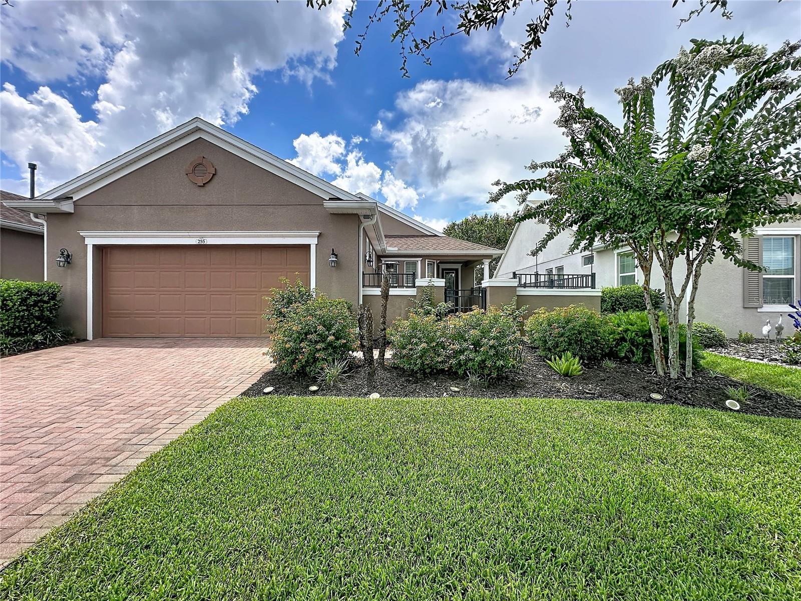 Welcome to this beautifully maintained Guardian model, in the sought after 55+ community of Cascades of Groveland. Built in 2016, this 1612 sq.ft. home offers 2 bedrooms, 2 baths, and an open concept design that blends comfort, style, and easy Florida living. Rich wood flooring flows throughout the main living areas, while plantation shutters add timeless elegance and privacy. The spacious kitchen is the heart of the home, featuring granite countertops, a new designer backsplash, abundant cabinetry, and a large breakfast bar perfect for casual dining or entertaining. The split-bedroom floor plan offfers privacy for both owners and guests. The spacious primary suite provides a peaceful retreat with an ensuite bath and a generous custom designed closet space. Step outside and enjoy multiple outdoor living spaces. Sip your morning coffee in the inviting front or rear courtyard, then relax in the enclosed rear lanai overlooking mature landscaping. An extended paver patio creates the perfect setting for grilling, entertaining, or simply enjoying Florida's beautiful weather. Additional highlights include a two-car garage, attractive curb appeal, and fully paid solar panels, providing exceptional energy savings with no loan or lease to assume. Cascades of Groveland offers an exceptional resort-style lifestyle with a magnificent clubhouse, indoor and outdoor pools, fitness center, tennis, pickleball, and bocce courts, walking trails, and an active social calendar with clubs and events. HOA fees include lawn
maintenance, gated entry, a premium cable and internet package, home monitored security, pest control and exclusive membership to the 57,000 sq.ft Magnolia House where you can enjoy a full service restaurant and bar, on-site fitness programs, athletic club, artisans studio, event center that is home to many weekly performances.
