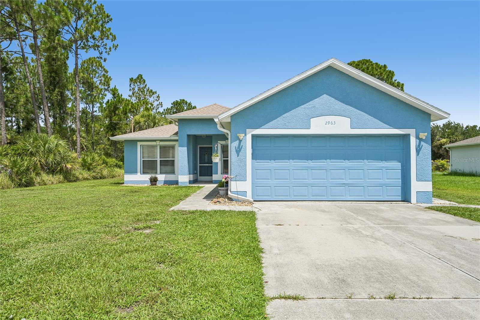 Welcome Home! Discover this charming 3-bedroom, 2-bathroom home in a highly desirable Southwest Florida location! Freshly painted on the exterior, this elevated home not in flood zone offers great curb appeal and a functional split-bedroom floor plan designed for comfortable living. As you enter through the screened front entry, you'll be welcomed by the kitchen, which opens to the spacious living and dining areas. The home's soaring ceilings create an open, airy feel, while ceramic tile flooring throughout provides both style and easy maintenance. The kitchen is equipped with stainless steel appliances, making it move-in ready. The screened lanai offers the perfect place to relax and enjoy Florida's beautiful weather. The 2-car garage features its own mini-split air conditioning system, creating a comfortable space for projects, a home gym, game room, or extra entertaining area. Enjoy peace of mind with numerous recent updates, including: New roof (2021) New septic system (2021) New well water pump (2021) New air conditioning system (2020) With no HOA fees and no deed restrictions, you'll have the freedom to bring your boat, RV, or other recreational vehicles. The spacious yard also includes a fenced area, providing plenty of room for pets to play. Conveniently located near shopping, restaurants, malls, hospitals, and with quick access to I-75, commuting is easy. Plus, you're only about 30 minutes from some of Southwest Florida's beautiful beaches and endless outdoor activities, including boating, fishing, biking, and world-class golf. Don't miss this opportunity to own a well-maintained home in a fantastic location with the freedom and lifestyle you've been looking for!