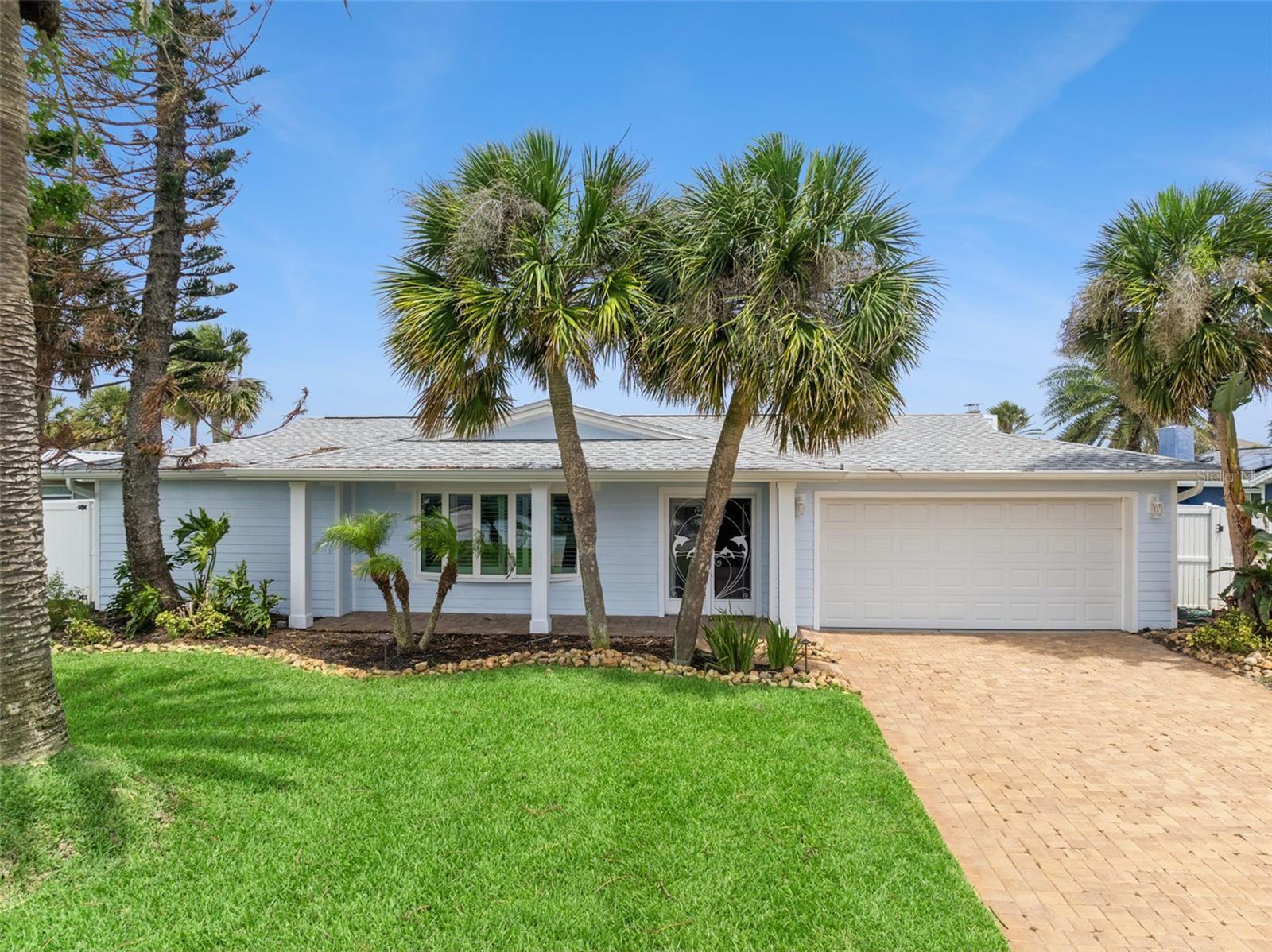 Beautiful 3-bedroom, 2-bath waterfront pool home offering the perfect blend of coastal charm and Florida living. Ideally located in the highly desirable city of Ponce Inlet, This exceptional residence provides stunning waterfront views, a private pool, and easy access to the area's pristine beaches, boating, dining, and recreational amenities. This beautifully maintained waterfront home features a remodeled kitchen with granite countertops, stainless steel appliances, newer cabinetry, and a built-in pantry. Abundant windows throughout the home provide an abundance of natural light, The spacious floor plan includes separate living, family, and dining areas, offering plenty of room for both everyday living and entertaining. Numerous updates have been completed, including brand-new exterior siding just recently completed, Roof replacement in 2023, impact windows and new sliding glass doors installed in 2019, fully refurbished pool and screened enclosure in 2018.Plantation shutters throughout the home add elegance and coastal charm. Enjoy true Florida waterfront living with an updated dock and covered boat lift, providing easy access to the water for boating and recreational activities. The primary suite features a walk-in closet, sliding glass doors with plantation shutters, and en-suite bath with a walk-in shower. Bedroom two includes a built-in closet, ceiling fan, and a convenient pull-down Murphy bed, making it ideal for guests or a home office. Bedroom three features a ceiling fan and sliding glass doors leading directly to the pool and lanai area. The guest bathroom offers a tub/shower combination and convenient direct access to the pool area. The exterior of the home is equally impressive, featuring mature tropical landscaping, an irrigation system, a brick paver driveway, and a private mailbox. The vinyl privacy-fenced backyard creates a secluded outdoor retreat. Come see this home today !