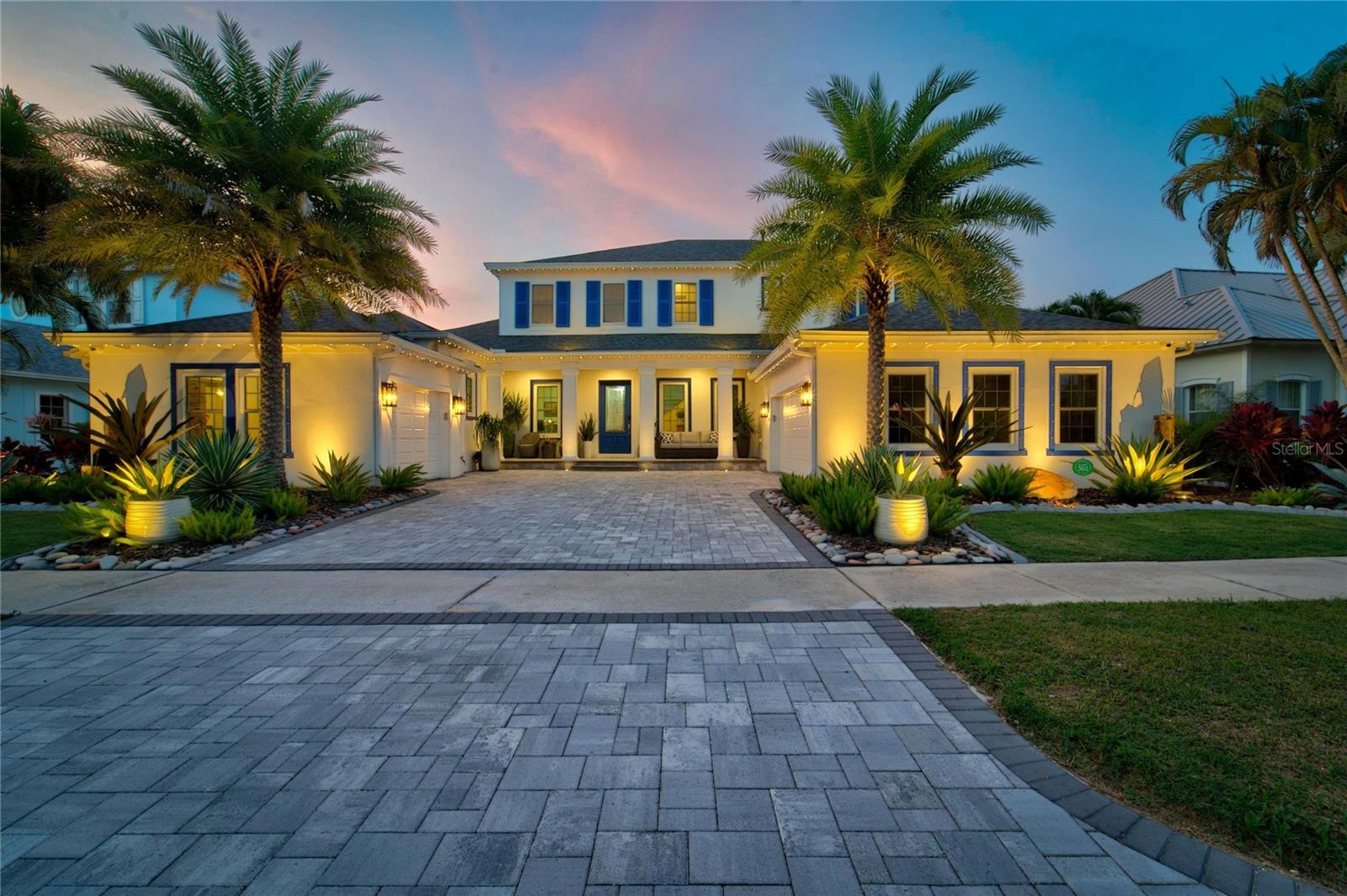 713 Islebay Drive | MiraBay | Apollo Beach
4 Bedrooms | 4 Bathrooms | 4,070 Sq Ft | 3-Car Garage | Pool | Private Dock with 13,000-LB Boat Lift | Direct Tampa Bay Access

Some waterfront homes offer a view. This one delivers a lifestyle.

Situated on a saltwater canal in the MiraBay community, this upgraded custom home offers a private dock with direct access to Tampa Bay, making boating, fishing, waterfront dining, and Gulf adventures part of everyday life.

From the moment you arrive, professionally designed landscape and architectural lighting, an upgraded paver driveway, and a permanent Trimlight exterior lighting system create exceptional curb appeal. Celebrate holidays and special occasions with customizable lighting year-round.

Inside, 4,070 square feet of designed living space blends timeless elegance with modern luxury. Rich hardwood and travertine flooring, soaring ceilings, and expansive hurricane-impact sliding glass doors fill the home with natural light while framing beautiful canal views.

Wake each morning as automatic motorized shades throughout the first floor rise to welcome the Florida sunshine. In the evening, they automatically lower for effortless privacy.

At the heart of the home is a spectacular dream kitchen. Completely remodeled, it features premium appliances including a natural gas cooktop with custom hood, double-door refrigerator and freezer, wine cooler, ice maker, extensive custom cabinetry, and dual oversized islands that naturally become the gathering place for family and friends. A stunning illuminated wine display showcases 54 bottles, creating a focal point. The kitchen flows seamlessly into the great room and outdoor living spaces.

The first-floor primary suite offers a spa-inspired bath and custom Closets by Design walk-in closet. A dedicated office provides work-from-home flexibility, while upstairs, a spacious theater and bonus room with a private balcony create the ultimate entertainment space. A custom candy and beverage station with a built-in wine cooler completes the theater experience.

Step outside to your waterfront oasis. The fully screened panoramic lanai captures breathtaking canal views, while the oversized outdoor kitchen with a large center island makes entertaining effortless. The travertine pool deck, sparkling pool, and custom Nebula LED lighting create a resort atmosphere.

Boaters will appreciate the dock featuring a 13,000-pound remote-controlled boat lift, integrated limit switches, aluminum service walkway, and Flushmaster freshwater flushing system for twin outboard engines.

Additional upgrades include hurricane-impact windows, doors and sliding glass doors, hurricane shutters, Hayward smart pool automation, Nelson whole-home water softener, Culligan reverse osmosis system, Rinnai tankless gas water heater with recirculation pump, seven-camera HD security system, metallic epoxy garage floors, remodeled pool bath, and paver walkways leading to the dock from both sides.

MiraBay residents enjoy a waterfront clubhouse and café, resort-style pool, fitness center, tennis, pickleball, basketball courts, parks, walking trails, and year-round community events.

From mornings filled with sunshine to afternoons on Tampa Bay and evenings entertaining poolside beneath custom lighting, 713 Islebay Drive offers an exceptional waterfront lifestyle where luxury, comfort, and boating come together.