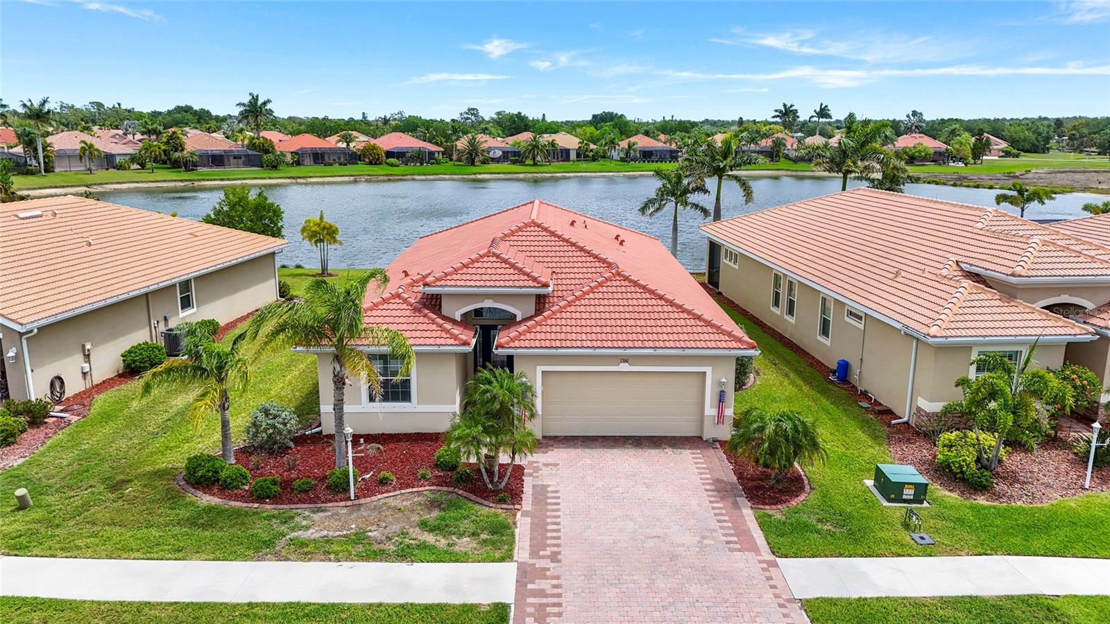 Positioned on one of the most desirable homesites in Talon Bay, this former DR Horton Edison model home captures stunning lake views from both the front and back of the property offering a truly picturesque setting within this sought-after gated community.

Inside, the bright open-concept layout is designed for effortless living and entertaining, with expansive living spaces, high tray detailed ceilings, and abundant natural light throughout. Triple sliding glass doors open to the spacious east-facing lanai, creating seamless indoor-outdoor living with peaceful morning sun and shaded afternoons overlooking the water.

The kitchen flows beautifully into the main living areas and features solid wood cabinetry, stone countertops, pantry storage, and generous prep space ideal for entertaining guests or everyday comfort.

The spacious primary suite offers lake views, a walk-in closet, and an oversized ensuite bath designed for relaxation. Additional highlights include a built-in sound system, oversized garage and driveway, drilled irrigation well, new AC, new hot water heater, hurricane protection, and model-home quality finishes throughout.

Residents of Talon Bay enjoy resort-style amenities including a clubhouse, fitness center, heated pool, tennis courts, kayak launch, scenic walking trails, and beautifully preserved natural surroundings — all with low HOA fees and no CDD fees.

Beautifully maintained, ideally positioned, and move-in ready, this is the kind of property buyers wait for.