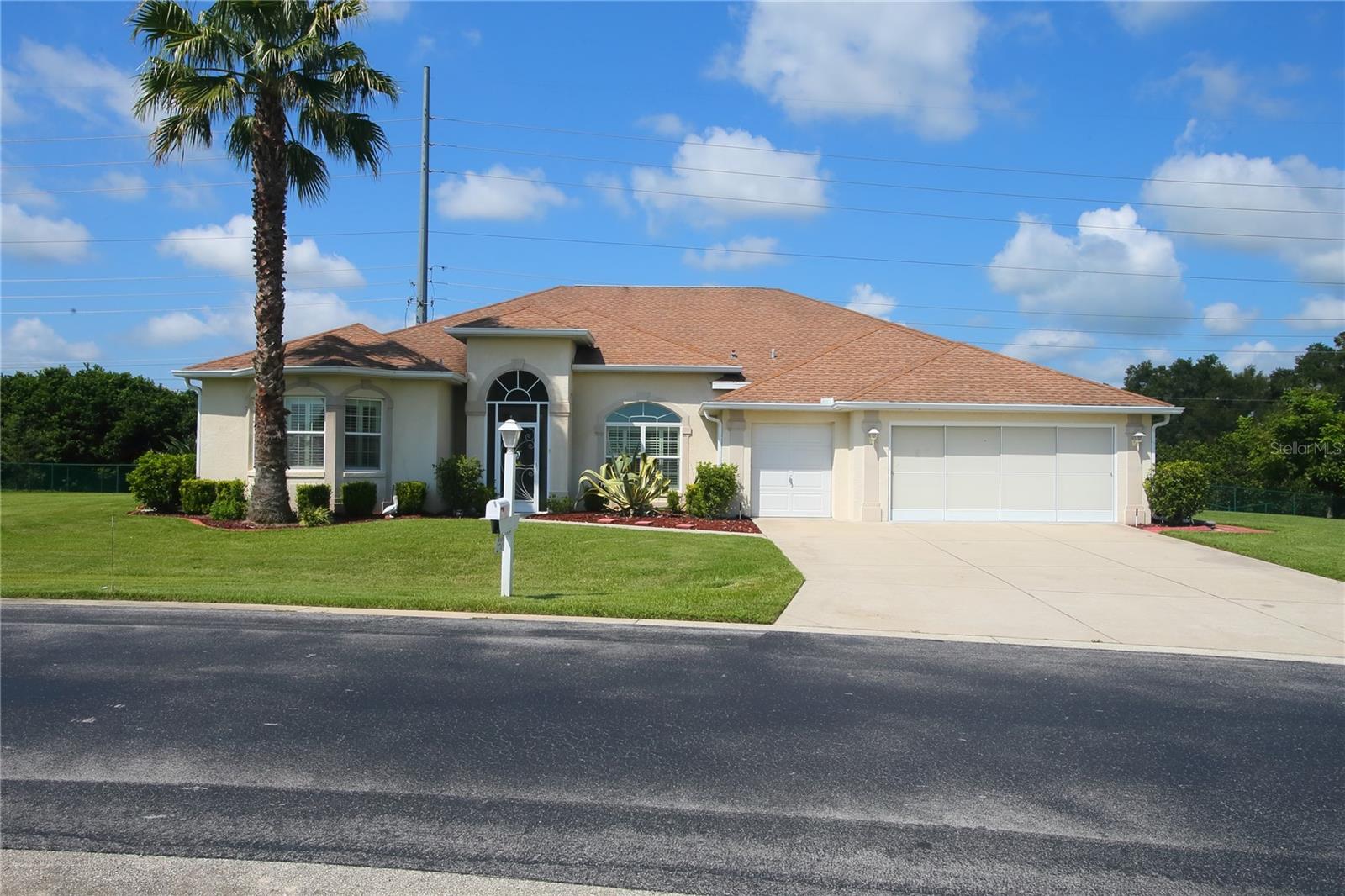 Welcome to your next NEW home! MOTIVATED TO SELL! The Grand Washingtonia Palm model has a very desirable layout for your most comfortable living.  With its formal dining room that opens up into the livingroom that leads to the screened lanai this home is comfort at its best!  The split bedroom floor plan offers privacy for all members of the family and/or guests.  The Master Suite has 2 large walk-in closets (His and Hers) and a spacious Master Bath with Garden tub.  The Master Suite also opens up to the screened lanai as does the livingroom. This property has one of the biggest lots in Ocala Palms at over 1/2 an acre.  It is fully fenced perfect if you have any pets.  On the lanai there is a hot tub that conveys with the home. This home has a 2 car garage and a space for a golf cart! The backyard has an orange tree, magnolias, Washingtonia palms and more and is beautifully manicured. You'll have access to all provided amenities including, clubhouse, pool and spa, sport courts, golf (additional fee), a golf cart community. HOA fees are $272/month which includes,trash pick up (once a week and basic cable additional($21).  Ocala Palms has access to many amenities including a Publix Shopping Center, Walgreens, & several restaurants right across the street.  The World Equestrian Center (WEC) is approximately 3.5 miles due West and offers several venues in addition to the equestrian tournaments that Ocala is so famous for.  There is also a 5 star restaurant in addition to several other pubs, restaurants & hotel available there.