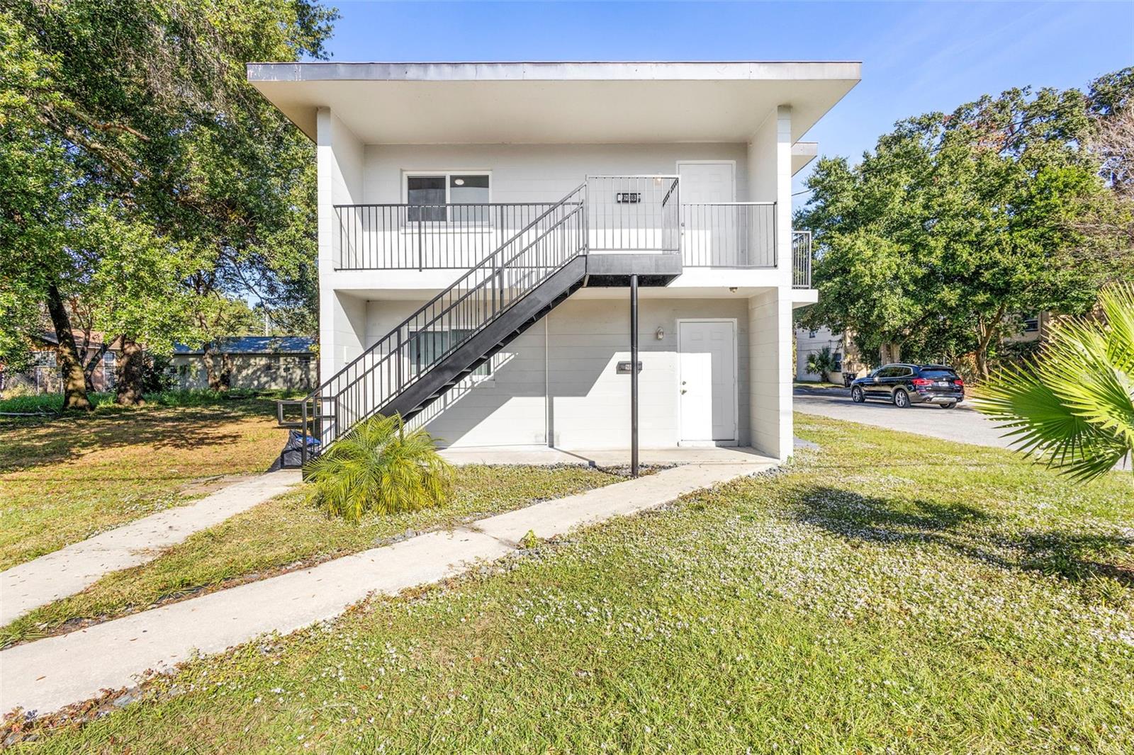 Listed below appraised value!!  Turnkey income opportunity in the heart of Orlando. This solid two story concrete duplex offers two fully updated units, each featuring 2 bedrooms and 1 bathroom, making it ideal for investors seeking immediate cash flow and long term growth. The first floor unit provides convenient rear access to a large parking pad shared by both units, while the upstairs unit features a private balcony that adds desirable outdoor living space.

Both units have been thoughtfully renovated with modern finishes, including wood look ceramic tile flooring throughout, updated cabinets and appliances, and energy efficient mini split systems installed in the living rooms and all bedrooms for optimal comfort. Each unit is also equipped with a brand new washer and dryer, making them highly attractive for future tenants. Separate electrical and water meters offer ease of management and utility responsibility, and the water heaters have been recently updated as well.

The property is currently vacant, allowing for a smooth and immediate closing with no delays. Positioned just steps from Inter&Co Stadium and located in a rapidly growing area of downtown, this duplex sits in the path of continued development and rising demand. Investors will appreciate the strong rental potential and the long term upside tied to the area's ongoing expansion and city backed improvements.

This is a rare opportunity to secure a fully updated, low maintenance asset in one of Orlando’s most active growth corridors. The heavy lifting has already been done, allowing a new owner to step in and start generating income right away while benefiting from appreciation for years to come.