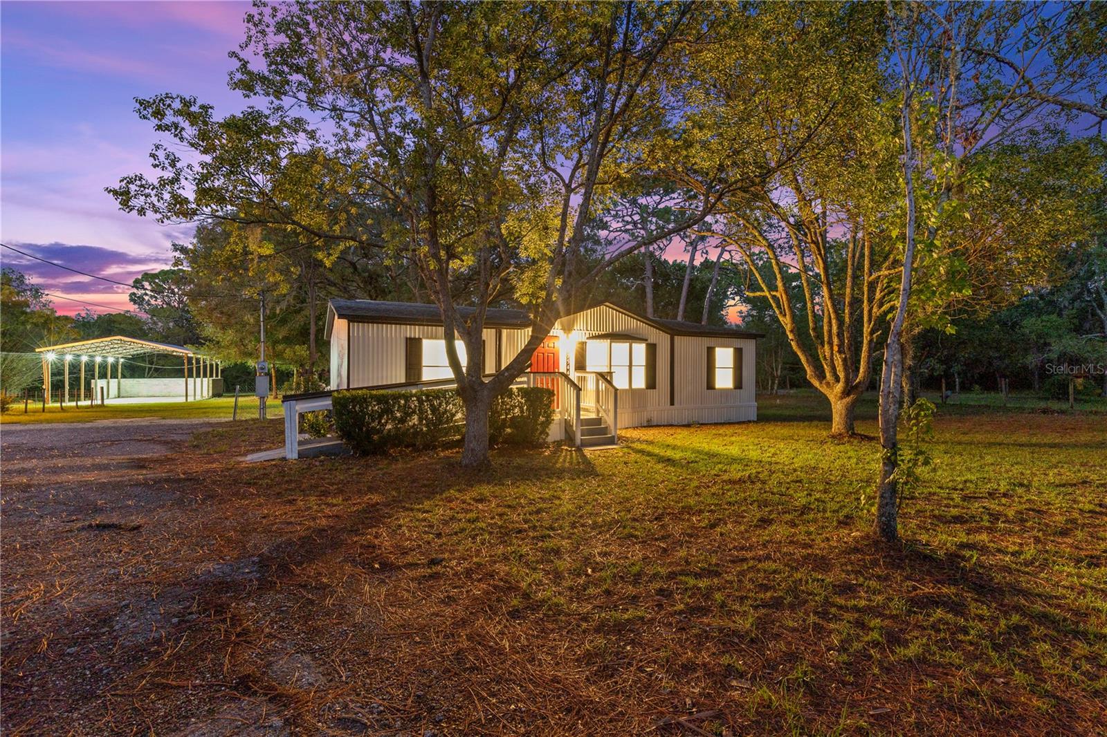 Virtually Staged. Discover the freedom of country living with all the modern updates you've been looking for. Situated on a spacious 1.13 acre corner lot with Agricultural Residential zoning, this beautifully renovated 3 bedroom, 2 bathroom (1400 Sqft TOTAL), double wide manufactured home offers room to live, work, and play with NO HOA, NO CDD, and NO flood insurance required.

The property is highlighted by a MASSIVE 52 x 32 (1696 Sq Ft) Newer Pole Barn built complete with electric and water, making it ideal for hobbies, equipment, a workshop, or additional storage, Big enough for your own Pickleball court, Outdoor living room or anything else you can envision. Bring your RVs, boats, trailers, and livestock with zoning that allows up to three grazing animals per acre.

Inside, nearly every major feature has been updated including New tile & luxury vinyl plank flooring, fresh interior and exterior paint, quartz countertops, Soft close wooden kitchen cabinets, all new appliances,  new lighting,  new ceiling fans, new plumbing, new well, new electrical breakers, new exterior vinyl skirting, new fencing where needed, and more. The open floor plan features vaulted ceilings and a spacious kitchen with a large island perfect for everyday living and entertaining.

Outback enjoy both a screened back porch and an additional open patio overlooking the private backyard. Roof 2016, HVAC 2018, & Water heater 2024 offering added peace of mind for years to come.

Conveniently located near shopping, dining, medical facilities, Weeki Wachee Springs, Pine Island Beach, the Suncoast Parkway, and the Gulf Coast, this property combines the privacy of country living with easy access to everything you need. Whether you're looking for space for animals, room for all your toys, or simply a move in ready home on acreage, this property delivers.