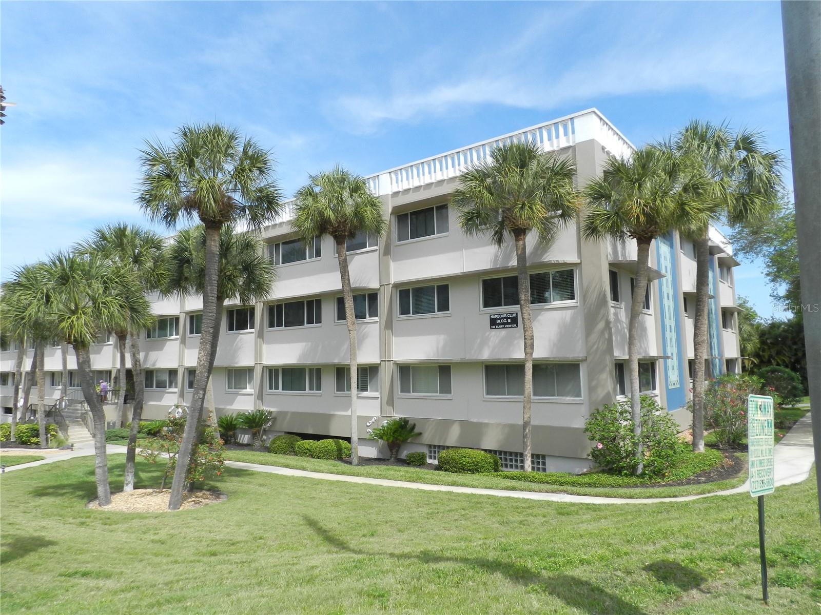 Affordable living in this resort style condominium at Harbour Club Condominiums in Belleair Bluffs, a 55+ community. Convenient location and just across the bridge to the beaches. Open kitchen with wood cabinets, granite counters, stainless steel appliances, pantry and breakfast bar.  Large living area with mirrors giving a larger spacious feeling plus crown mokding. The  bedroom is large with a spacious  walk in closet. THe primary bath has dual vanities, wood cabinets and granite counter. There is a tub plus a separate shower.  Off the bedroom is a den, office or sitting room. Unit comes with 1 assigned parking space in the parking garage and a large storage room.  Conveniently located on the 1st floor just steps fron the lobby, mailbox and elevator.  Community has a gathering room, exercise equipment, pool, BBQ area, shuffleboard, beach area, pool, poker table and kitchenette.  Near restaurants, Hospital, Golf Course and just across the bridge from the Gulf Beaches.  Great location for a permament residence or 2nd home.  All room dimensions are estimated.  Buyer shoud measure rooms for the exact sizes and verify all information.