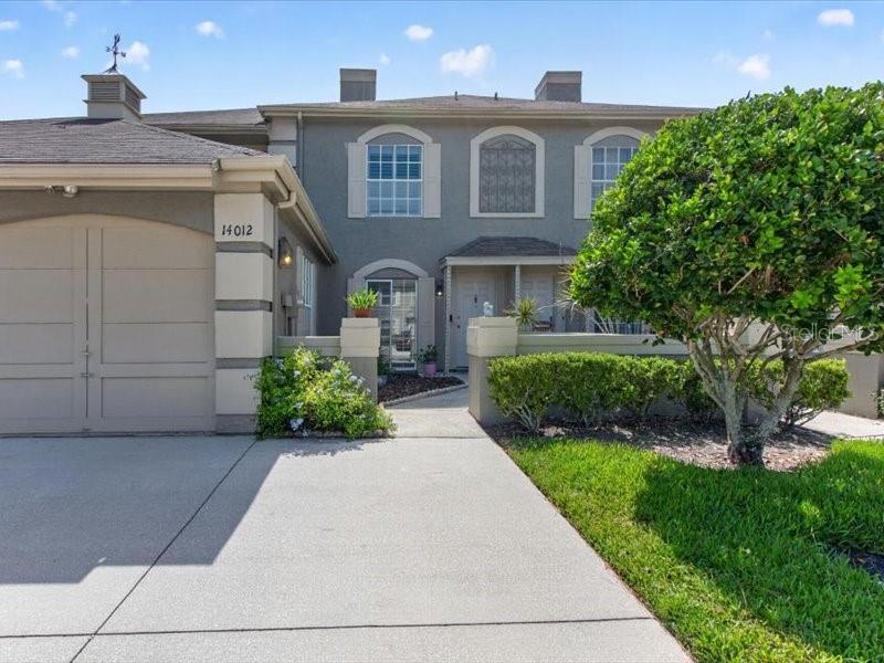 Virtually Staged. Welcome to this beautiful townhouse in the highly sought-after Chardonnay subdivision of Carrollwood Village. Offering 2 bedrooms, 2.5 bathrooms, and 1,468 square feet of comfortable living space, this home combines charm, functionality, and low-maintenance living in one of Tampa's most desirable communities. Just minutes from the beautiful Carrollwood Village Park, this move-in-ready home has been freshly updated with new interior paint throughout and brand-new flooring on the staircase and upstairs. 

The spacious main level features an open living and dining area, a well-appointed kitchen with granite countertops, and a cozy family room that opens to a private patio overlooking the community pool. Upstairs, the spacious primary suite includes a large walk-in closet, a separate dressing vanity, and abundant natural light, while the second bedroom offers a generous closet and its own full bathroom. A conveniently located upstairs laundry room adds everyday convenience. Additional features include a one-car garage and a low HOA fee of $174 per month.

The HOA includes access to the community pool, lawn maintenance, and exterior painting. Enjoy everything Carrollwood Village has to offer, including parks, walking and biking trails, tennis, basketball and pickleball courts, dog parks, a splash pad, playground, golf, and the Carrollwood Cultural Center. Conveniently located just minutes from top-rated schools, shopping, dining, Starbucks, the YMCA, Veterans Expressway, and more. 

Don't miss your opportunity to own this beautiful home in a prime Tampa location. Schedule your private showing today!