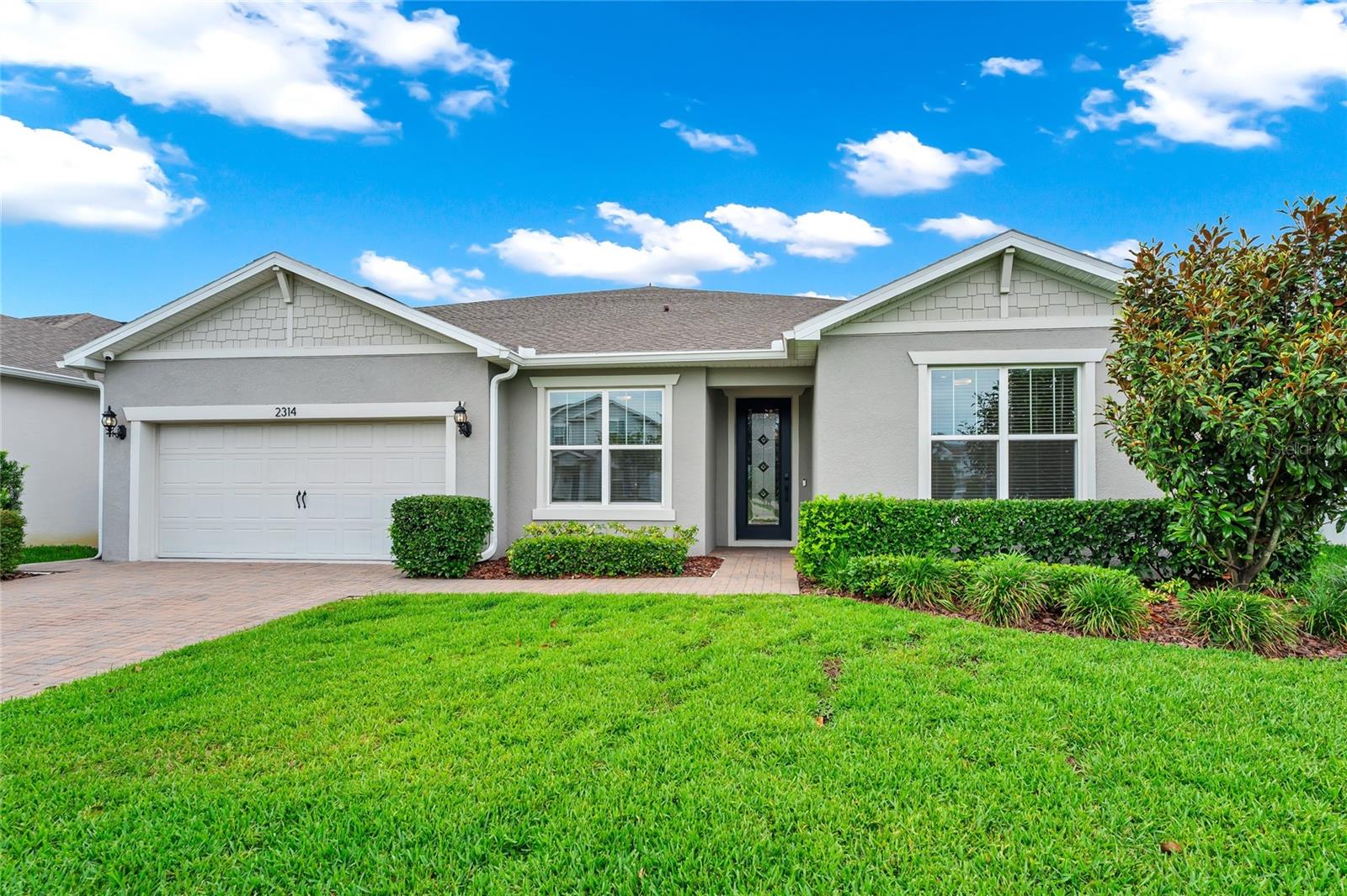 Welcome to the one buyers have been waiting for in Live Oak Lake. This beautifully upgraded 6 bedroom home combines luxury finishes, functional space, and breathtaking views that truly set it apart. From the backyard, enjoy stunning views of Live Oak Lake that create the perfect backdrop for peaceful mornings, relaxing evenings, and unforgettable gatherings.  

Inside, the home features a spacious designer kitchen that was made for entertaining, family holidays, and everyday living with seamless flow into the open concept living and dining areas. Freshly painted and thoughtfully upgraded throughout, this home offers both style and comfort at every turn. The oversized primary suite features a luxurious super shower, while additional upgrades include a retractable screen on the back lanai, closed circuit security cameras for added peace of mind, and over $150,000 in upgrades throughout the property.  

With expansive living spaces, generously sized bedrooms, and a layout that works beautifully for families, guests, or multi generational living, this home stands out from the competition. Located in one of St. Cloud’s most desirable communities with convenient access to Lake Nona, top rated schools, shopping, dining, and major roadways, this is a rare opportunity to own a truly special home with luxury, space, and unforgettable lake views.