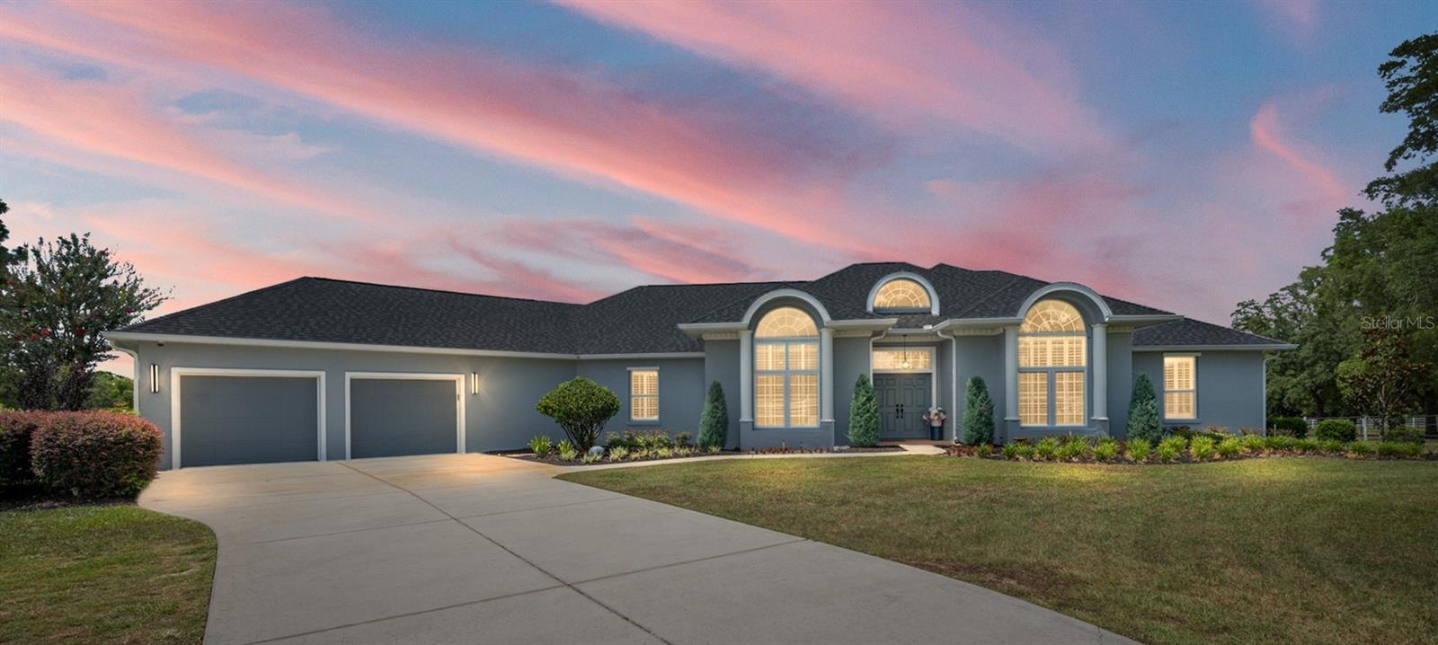 Welcome to Lexington Downs, a gated equestrian community in SW Ocala. This fully renovated 6+ acre farm offers the perfect blend of luxury, comfort, and functionality, complete with an incredible new barn designed for your horses.  This 4-bedroom, 3-bath home features porcelain tile flooring throughout, volume ceilings, extensive windows for natural light, and plantation shutters. The inviting foyer opens to the living room, family room, and redesigned kitchen, all finished with high-end appointments. The living room features a gas fireplace, while the formal dining room is conveniently located just off the kitchen. The updated kitchen offers new cabinetry, quartz countertops, a spacious breakfast bar, and a breakfast nook. The adjoining family room creates a comfortable casual living space and includes a second gas fireplace.  The primary suite is thoughtfully designed for relaxation, featuring a sitting area overlooking the property, a spacious walk-in closet with an organized storage system, and a beautifully updated bath with dual vanities and a dual-head shower. Guest bedrooms offer easy access to the additional baths, while the fourth bedroom provides flexibility for an office, hobby room, or guest space. The utility room offers generous space for laundry, projects, and storage.  The oversized 22’ x 33’ garage provides room for two vehicles plus a golf cart. Step outside to the enclosed patio and enjoy peaceful views of the farm and four paddocks.  Equestrian amenities shine with the newly built 38’ x 48’ four-stall barn, featuring adjustable stall dividers, a spacious feed room, tack room with built-in cabinetry, wash rack, and an efficient layout for daily horse care.  Located just minutes from the Florida Horse Park and a short drive to the World Equestrian Center, shopping, dining, and everyday conveniences, this exceptional farm offers thoughtful design, a luxurious home, and an ideal SW Ocala location.