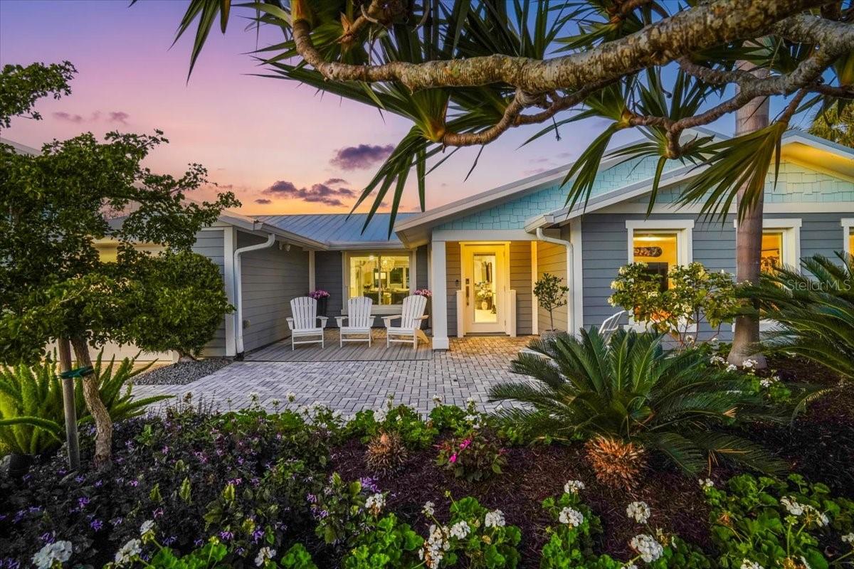 Experience coastal luxury in this stunning waterfront home located in the highly sought-after Key Royale community. Completely remodeled to the studs in 2021, the residence features a substantial addition that introduced a generously sized family room which is ideal for guest overflow, a dedicated movie room, or a relaxed secondary living area. This meticulous renovation ensures unparalleled peace of mind, featuring a metal roof with spray foam insulation, durable Hardie board siding, and all-new plumbing, air ducts, and electrical systems. The convenience of ground-level living is coupled with the incredible security of a Garrison Flood Prevention system, installed in 2025 at all eight potential water intrusion points. The open-concept layout features a true chef’s kitchen anchored by an oversized island and sleek, custom cabinetry. The heart of the home is designed for the ultimate Florida lifestyle, where opening the large sliding glass doors creates a seamless connection between the interior and the expansive outdoor living space, making it incredibly convenient to host large gatherings while enjoying the coastal breeze. Sophistication meets functionality with Kohler fixtures throughout and a premium Toto Neorest washlet in the primary suite. For the modern professional or host, custom Monarch Murphy beds in the guest bedroom and office offer effortless versatility, while remote-controlled blinds in the den, dining area, and patio doors allow for instant privacy. You can control this entire smart home directly from your phone, including multiple security cameras, alarm and locking systems, and Z-wave lighting throughout. The outdoor living space is a true resort, centered around a sparkling pool and spa surrounded by lush landscaping, an irrigation system, and elegant landscape lighting. Boaters will enjoy the high-end Trex dock, which includes a 7,500-pound lift, a rough-in for a 16,000-pound lift, and multiple locations for electric and water service. Thoughtful additions such as an outdoor shower and 30-amp RV outlets at the front ensure this estate is as practical as it is beautiful, offering a rare turnkey lifestyle in an exquisite waterfront setting. Call today for your private showing!
