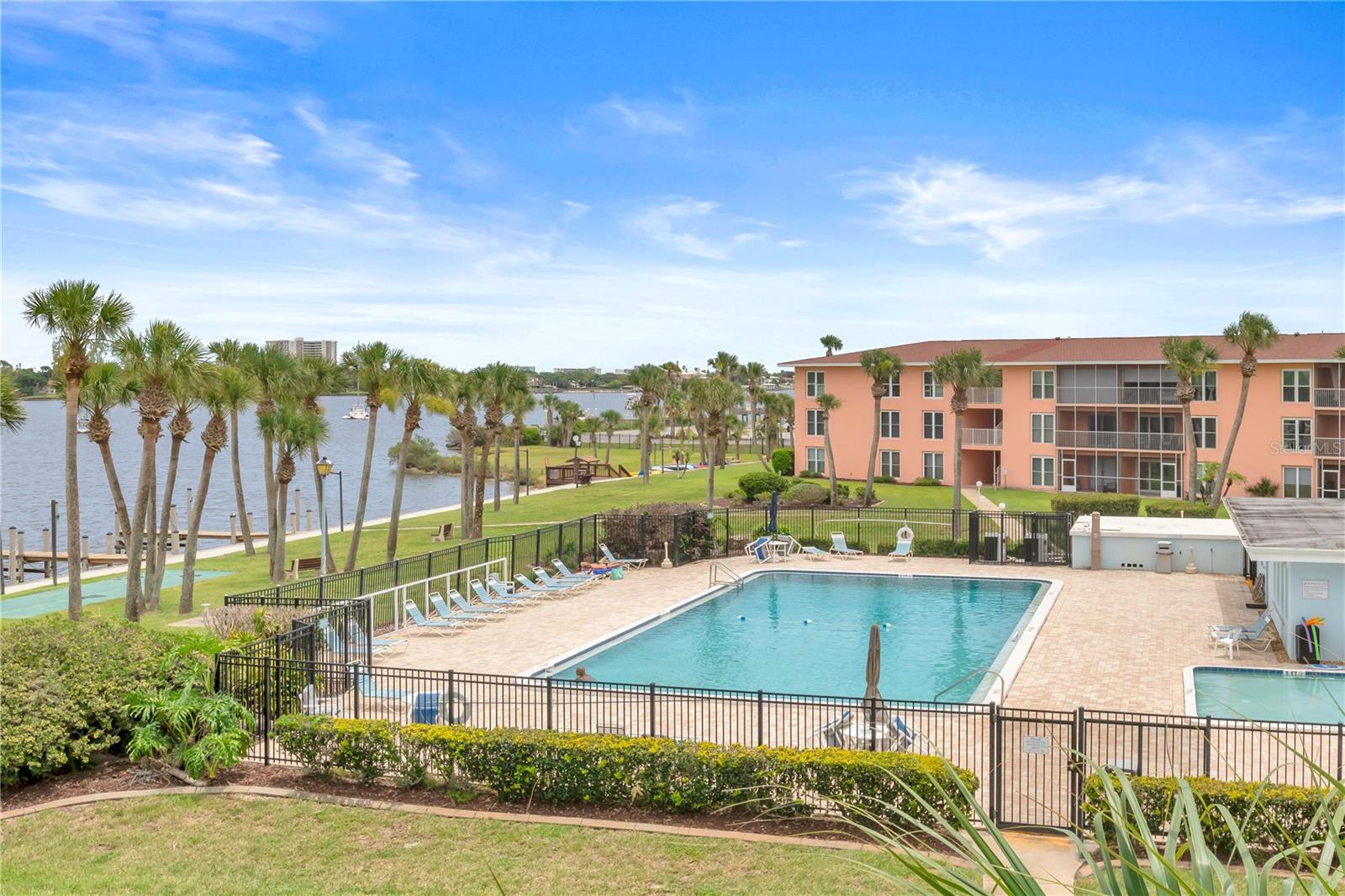 Live the sunny Florida life on the stunning Atlantic Intracoastal Waterway. The Daytona Beach Marina and Halifax River water views are directly seen right from inside this unit, including morning sunrises over the river, from the kitchen, and fiery evening sunsets over the marina, from the screened balcony. Newly, updated 2-bedroom, 2- bath, open concept condominium, on the second floor in the Riverhouse Condominiums in Daytona Beach, Florida. The nearby South Beach Street is becoming a real destination. The beautiful mile-long Riverfront Esplanade right along the Halifax River — has walking trails, a botanical garden, dog park, splash pad, benches, swings, and the Single-A Jackie Robinson Ballpark. The southern section of the Esplanade opened in 2023, right near the newly built Veterans Memorial Bridge, completed in 2020, which they also call the Orange Avenue Bridge.
It’s packed with events now, too — weekly Friday night Riverfront Market with local vendors and live music. The whole area’s getting that lively waterfront vibe with better sidewalks, lighting, and pedestrian upgrades that make it way more walkable and inviting.
This condominium has all NEW stainless steel appliances, including new water heater. NEW LVP (Luxury Vinyl Plank) flooring. All NEW white Shaker cabinets and all NEW white Skaker bathroom vanities, all with granite countertops. NEW lighting in kitchen, dining, and both bathrooms. The complex provides Pickleball court/tennis court, large heated pool with clubhouse, designated parking spot right in front of the unit, a storage locker, seawall fishing, outdoor kayak storage, and a FREE PERSONAL BOAT SLIP which is available on a first-come-first-serve basis, and slips are available now. Past assessments for improvements to the complex, required by Florida state law, have all been paid in full. This Florida condominium, Riverhouse Condominiums, has fully met, passed, and completed the required- by- law inspection requirements for all condominiums in the state of Florida.
Perfect location. The “World Famous Daytona Beach” is right across the Orange Avenue Bridge- 1.8 miles. Daytona Beach International Speedway is 4.4 miles from here, and the Daytona Beach International Airport is 4.7 miles away. Perfect Location.