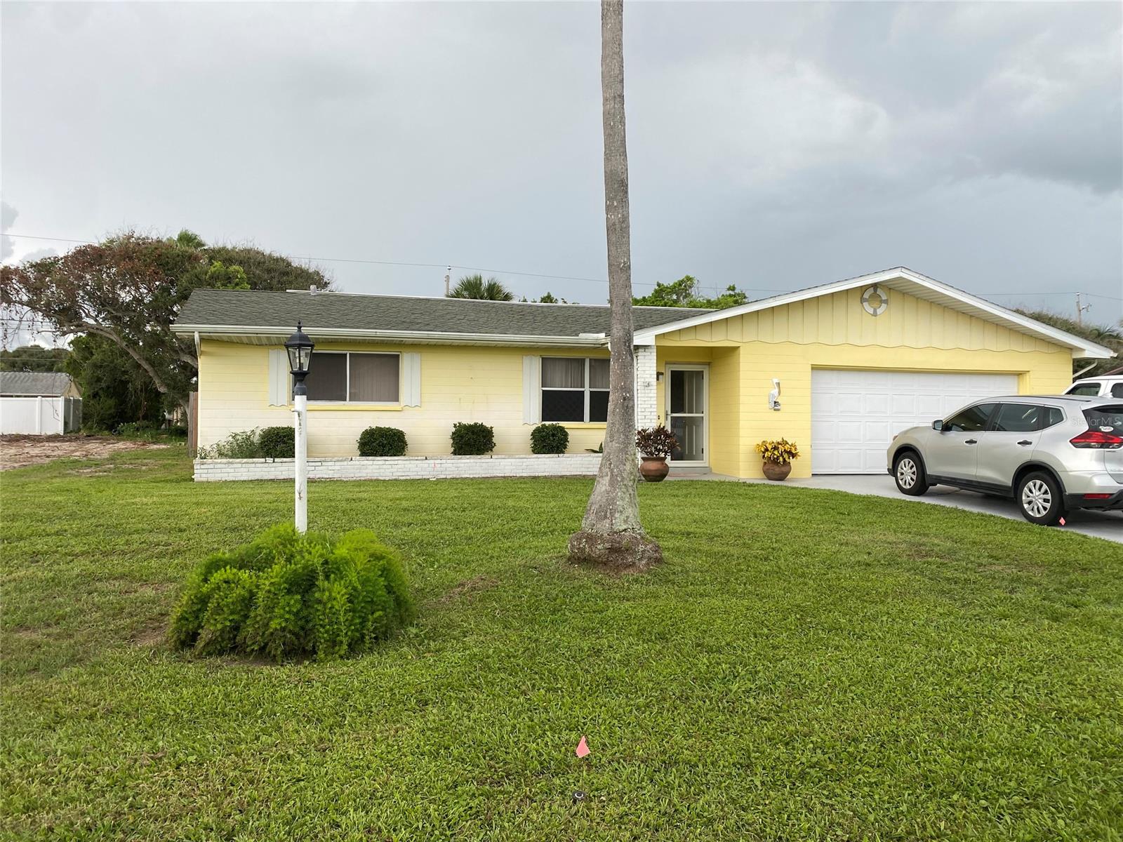 This 2bed/2 bath home is located in the highly desirable "no drive beach area" just 2 blocks to the white sand beach and ocean. Also, you are just steps away from the boat ramp for kayaking or paddle boarding in the intra-coastal. The home sits on a .32 acre lot all privacy fenced in with a shower outhouse to wash off all the beach sand, the property also has a full irrigation system. This home posses a open concept  living room and a fireplace family room and over sized 2 car garage. All information is intended to be accurate but cannot be guaranteed. ;Water: City