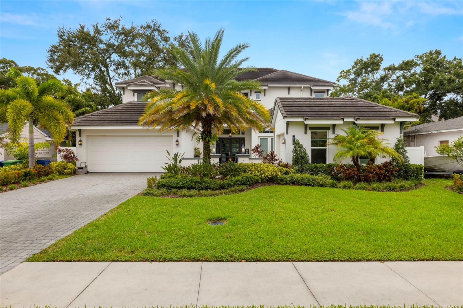 This stunning West Indies-style pool home is located in flood zone X and offers an exquisite blend of luxury and functionality. Boasting 6 bedrooms, 6 full bathrooms, and 1 half bath, this residence is designed for both comfort and elegance. The front of the home welcomes you with a spacious courtyard and a 3-car split garage. Inside, the first floor features an inviting foyer, study, great room, utility room, mudroom, and a chef's dream kitchen, complete with a butler's pantry, all open to the dining and great room. The primary owner's suite on the first floor includes a large walk-in closet for ultimate convenience. Additionally, a private guest suite with its own entry offers privacy and comfort, ideal for visitors or extended family.

The home boasts high-end additions such as a 550-gallon fish tank system, a recently installed generator, a whole-house sound system, and a state-of-the-art security system with cameras. Two brand new tankless water heaters ensure efficient, endless hot water supply.

Upstairs, you'll find four generously sized bedrooms, each with a walk-in closet and en-suite bath, along with a spacious game room for entertainment. Outdoors, a large covered patio with an outdoor kitchen overlooks the expansive pool area, providing the perfect setting for relaxing or entertaining. This home is a true oasis, combining indoor luxury with outdoor leisure for an unparalleled living experience.