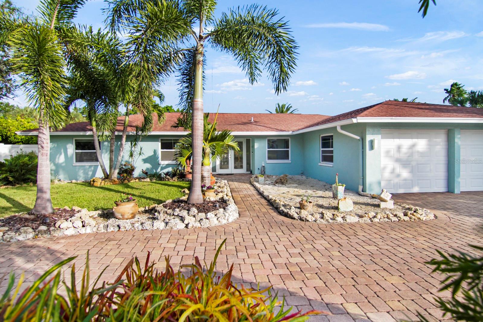 Waterfront Southgate Pool Home with Boat Lift.  This home has all the updates and features that you could hope for.  With well over 2000 sqft, this home has been completely updated with many custom features.  It has a high end gourmet kitchen with level 4 blue granite and custom cabinetry, remodeled bathrooms and contiguous porcelain flooring.   The floor plan wraps around the screened pool and wet bar.  There is a separate entrance for the guest suite making for a perfect Airbnb or mother-in-law suite.

Situated right on the Philippi creek only three bridges from the ICW, this 1/3 acre oversized lot has an 10,000 pound boat hoist that can handle just about any size boat.  Perched nearly 20 feet above the water, this home does not require flood insurance.

The attractive mature landscaping gives the home great curb appeal, but the water side of the home is even more impressive.   With a screened pool enclosure, custom stonework, propane fire pit and lots of landscape lighting, this home is perfect for entertaining or just relaxing with the family.  Dont miss all of the fruit trees on the north side of the home or the maintenace free composite deck. There is plenty of storage beyond the spacious 2 car garage because of the attached shed and covered outdoor storage area.  The home is well suited for families and is located within the highly desirable Southside Elementary school district with tons of kids in the neighborhood.  Schedule your showing today.