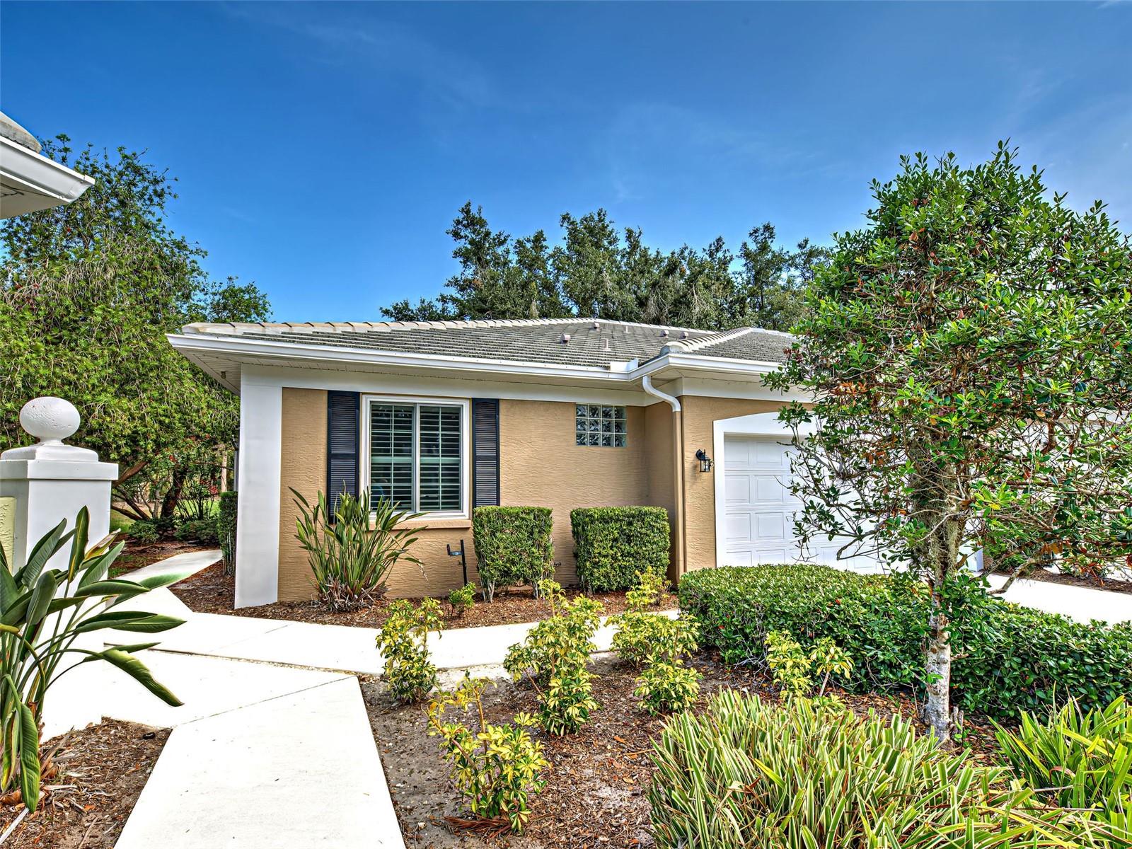 One or more photo(s) has been virtually staged. MAJOR PRICE REDUCTION TO SELL!!  Maintenance-Free Villa in The Plantation G&CC – Light, Bright & Thoughtfully Designed.

Welcome to effortless Florida living in this beautifully maintained 3-bedroom, 2-bath villa located in the desirable Plantation Golf & Country Club community. This light and bright home offers a spacious open layout, where the living and dining areas come together to form a large, welcoming great room—ideal for both everyday living and entertaining.

The kitchen includes a custom-designed cedar passthrough/bar to the living room, complete with barstool seating available on both sides—perfect for casual meals or hosting guests.

The air conditioned Florida room seamlessly connects the kitchen, great room, and screened outdoor lanai area, and features a cozy stand-alone propane fireplace—an ideal spot to relax and unwind.  

The spacious primary bedroom includes a walk-in closet and a private ensuite bathroom, offering a peaceful retreat at the end of the day. One of the guest bedrooms, located just off the great room with a stylish double-door entry, was previously used as an office—providing flexible space to suit your lifestyle.  The third bedroom is separate from the main living space for privacy and adjacent to the guest bathroom.

Crown molding and designer touches throughout the home add elegance and character, while impact windows and Plantation shutters provide both peace of mind and aesthetic appeal.  Important updates include:  New stove with convection and roast settings, 2024; Roof replacement, 6 inch gutters with gutter guards and downspouts, microwave oven in 2022; Hurricane windows, Kevlar shield for sliding glass doors in 2020; Garage door update with all working parts replaced, new disposal in 2019; Back lanai rescreen, new water heater in 2017.

Beyond the comforts of home, this villa offers proximity to Wellen Park, a vibrant master-planned community featuring Cool Today Park, the Spring training home of the Atlanta Braves as well as a variety of shops, dining options, entertainment venues, parks, and trails.  Beaches, and all that the historic downtown of Venice has to enjoy is just a short drive away.

Whether you're seeking a full-time residence or a seasonal escape, this home provides the perfect combination of comfort, function, and low-maintenance living—all within the vibrant and amenity-rich Plantation G&CC community.  Country Club memberships are available and are optional.