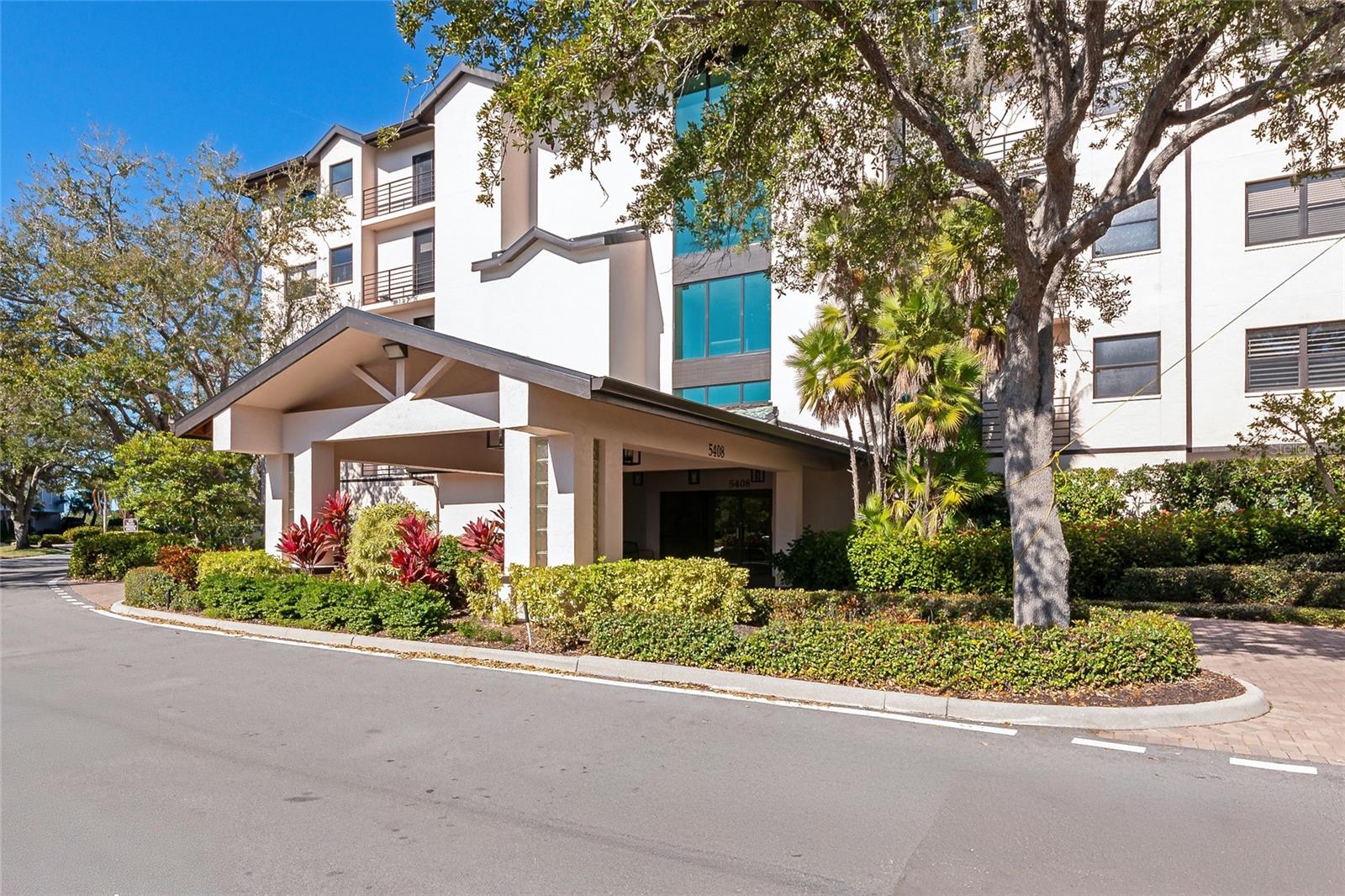 THIS IS THE LOWEST PRICE UNIT BY A STAGGERING $100,000, making it the clear standout for buyers who understand value.  BRING THE OFFERS. SELLER FINANCING AVAILABLE. SELLER OFFERING HOA FEES TO BE PAID AT CLOSING. Discover your slice of Sarasota paradise with panoramic Intracoastal Waterway views and unforgettable sunsets from every room of this beautifully updated third-floor condo in Eagles Point at The Landings, one of Sarasota’s most desirable West of Trail, gated communities, just minutes from world-famous Siesta Key Beach and downtown. This light-filled residence showcases brand-new, top-of-the-line impact windows and an expansive triple-glass impact sliding door, offering both peace of mind and stunning views over mangroves toward Siesta Key and the Gulf beyond. The building’s common areas have also been upgraded with impact windows for added security and value. Step inside to an inviting open-concept great room, ideal for entertaining. Features include luxury vinyl plank flooring, fresh neutral paint, and designer lighting throughout. The chef’s kitchen is a standout with quartz countertops, designer tile backsplash, newer stainless steel appliances, abundant cabinetry, and an oversized island with wine and beverage refrigerator, perfect for gatherings. Double glass doors lead to the spacious primary suite, complete with a private sitting or office niche, dual walk-in closets, and a spa-inspired bath featuring double vanities and a large walk-in shower. A generously sized guest bedroom and bath are thoughtfully positioned for privacy, with gulf-facing views sure to impress visitors. The sun-drenched flex space/sunroom off the kitchen offers the home’s best view and is ideal as a breakfast café, dining nook, or serene retreat. Additional highlights include a full indoor utility room, new washer & dryer (2021), new A/C with humidistat (2021), and water heater (2020). The unit includes under-building parking, extra storage locker, kayak or paddleboard storage, bike room access, and ample guest parking. Eagles Point residents enjoy a private pool and grill area, plus membership in The Landings Racquet Club, featuring Har-Tru tennis courts, pickleball, junior Olympic lap pool, spa, fitness center, library, and an active social calendar. Enjoy a waterfront lifestyle with mangrove-lined walking paths, fishing gazebo, kayak launch on the Intracoastal, and lush tropical surroundings, all just minutes from downtown Sarasota, fine dining, shopping, and cultural attractions. Luxury, location, and lifestyle converge here. Schedule your private showing today before this opportunity is gone!