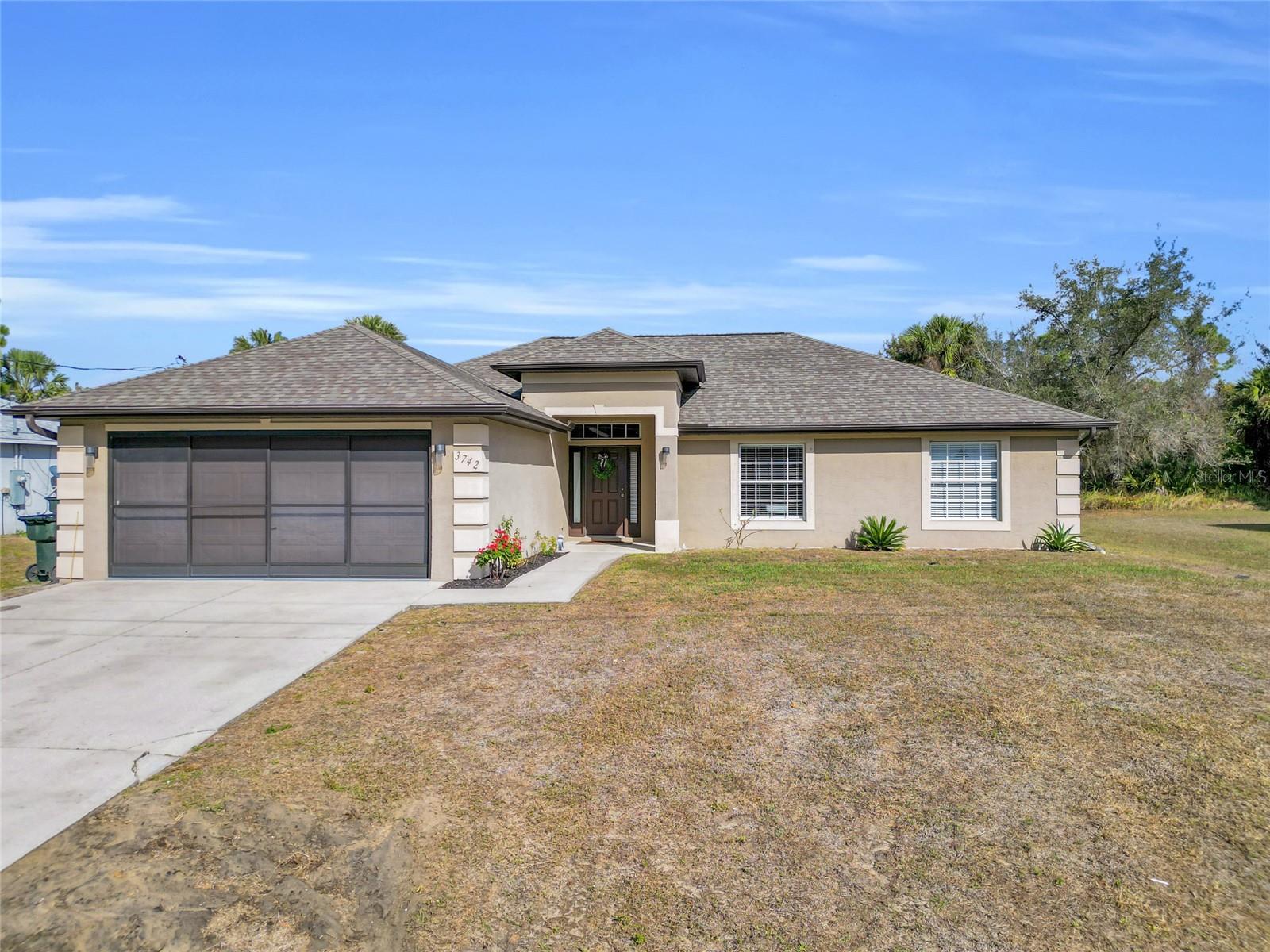 This well-designed home offers space, comfort, and an ideal location for today’s lifestyle. Featuring over 1,800 sq. ft. of open-concept living, the layout is both functional and inviting, highlighted by high ceilings, decorative built-ins, and tile flooring throughout the main living and wet areas.

The kitchen is thoughtfully designed with wood cabinetry, ample storage, a closet pantry, and a breakfast bar perfect for casual dining. The split-bedroom floor plan provides privacy, with guest rooms separated from the primary suite. The primary bedroom features a walk-in closet, dual-sink vanity, and a tub/shower combination.

Guest bedrooms showcase new laminate flooring, and an additional den with a door offers flexible use as a home office, playroom, or potential fourth bedroom. Finished in neutral, inviting tones, this home is truly move-in ready. New gutters have recently been installed to enhance exterior durability.

Located in North Port, a fast-growing, family-friendly community recognized for excellent schools, safety, and job growth, this home offers both comfort and long-term value—conveniently close to shopping, dining, and daily necessities. Not in Flood Zone- NO HOA!  Easy to show!