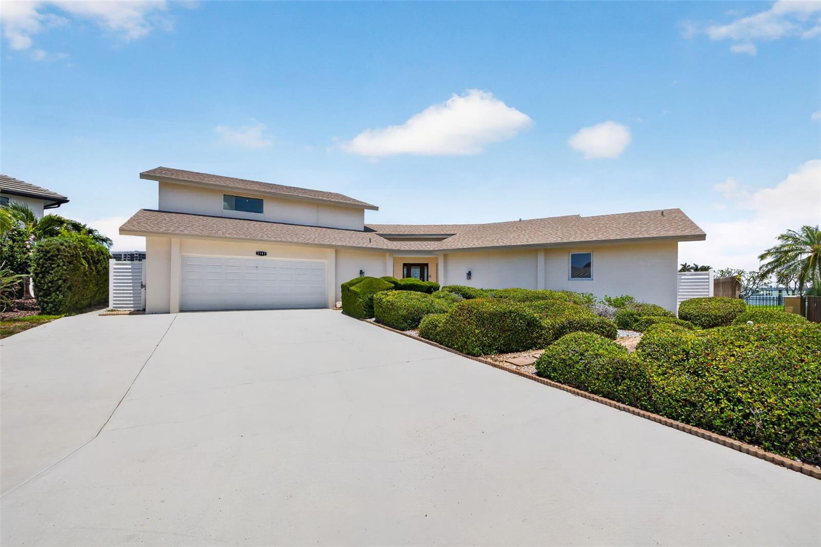 Positioned at the end of a quiet cul-de-sac in Belleair Beach, this rare waterfront opportunity offers 167 feet of protected deep-water frontage, exceptional privacy, and expansive open water views that are increasingly difficult to find. Designed to accommodate serious boating, the dock can support an approximately 60-foot vessel while still providing quick access to Clearwater Pass and the Gulf.  Spanning approximately 3,897 square feet, the residence includes four bedrooms, four bathrooms, a pool, and an attached two-car garage. While the interior is ready for a comprehensive cosmetic renovation, the property presents an exceptional opportunity to create a custom luxury waterfront home tailored to your own vision and style.  Importantly, many of the home’s most expensive and critical components have already been upgraded within the past several years, including the roof, HVAC systems, windows, and doors. With these major improvements already completed, a future owner can focus primarily on redesigning and modernizing the interior living spaces.  The existing floor plan offers generous living spaces and was thoughtfully positioned to take full advantage of the beautiful water views and natural light throughout the home. The protected waterfront setting combines the privacy boaters desire with the openness of wider water vistas, creating a rare balance that is difficult to replicate.  The rear northern exposure provides soft natural light throughout the day while still allowing for colorful sunrises and beautiful evening sunsets to become part of the daily waterfront experience. Outside, the pool, dock, and existing lift infrastructure provide a valuable foundation for creating an extraordinary outdoor living environment.  Surrounded by luxury waterfront homes in one of Belleair Beach’s most desirable locations, this is not simply a renovation project—it is a rare opportunity to create a personalized coastal estate with exceptional boating water, substantial frontage, and long-term value.