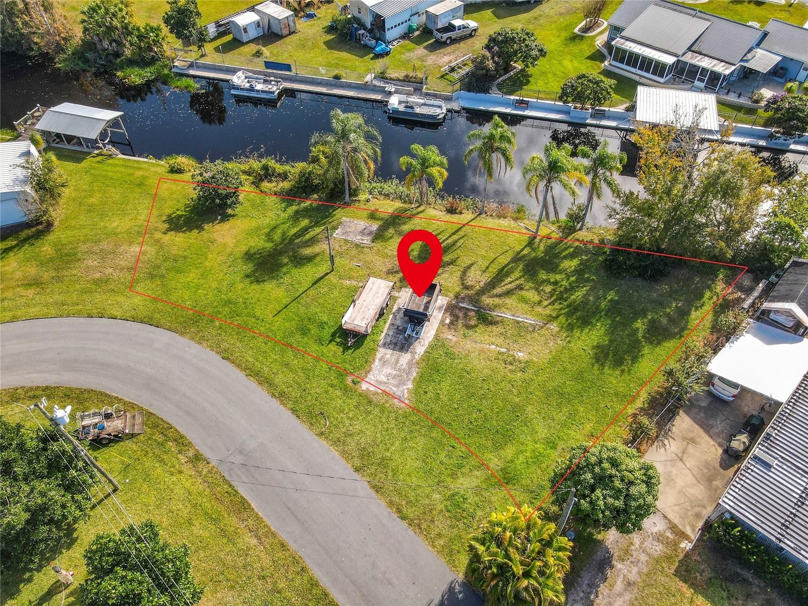 Canal-front lot offering direct water access to Lake Lizzie and the sought-after Alligator Chain of Lakes, known for boating, fishing, and outdoor recreation. This approximately 0.16-acre homesite is situated on a quiet street and provides a rare opportunity to enjoy a true Florida waterfront lifestyle, with the ability to kayak, fish, or cruise from your backyard through the connected lakes. Zoned for residential use, with no HOA and electric available. Conveniently located within easy reach of St. Cloud, Lake Nona, and major roadways, and approximately one hour’s drive to the Atlantic beaches, this property offers a unique blend of privacy, recreation, and accessibility. Prior residence existed on the site, which may provide potential impact fee savings for a new build Buyer and buyer’s agent to verify all information, including zoning, measurements, conditions of existing septic tank and well, and water navigability.