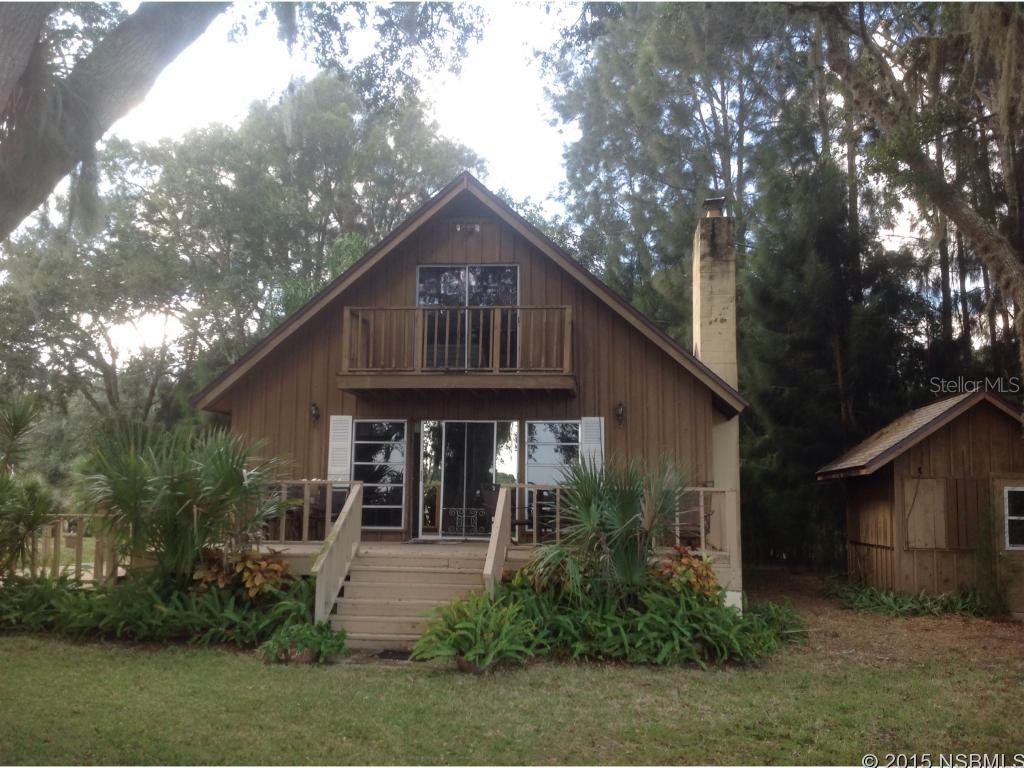 CANAL FRONT A FRAME HOME  is located at the end of the canal only a few 100 yards to the Indian River...Views are spectacular from the upper and lower decks.  Inground pool, launch area for canoes and kayaks, fishing dock, smoke house, storage shed  and a 2 car carport.  Approximately 1/2 acre.  Repiped and newer A/C unit. Stone fireplace in the cozy living area.  Shrimp or fish from your private dock and enjoy the peace and quite....You will not want to leave...... ;Water: City