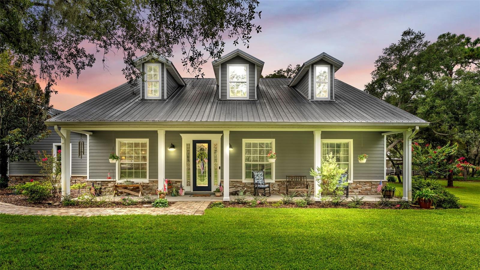 Experience the best of Florida country living on nearly 5.5 beautifully maintained acres with this custom-built 3-bedroom, 2.5-bath home. Designed with both comfort and functionality in mind, this property offers the space, privacy, and versatility that today's buyers are looking for. The fully fenced acreage features cross fencing and a gated entrance, making it well-suited for horses, livestock, or anyone wanting room for recreational vehicles, equipment, or outdoor hobbies. A spacious two-car garage is complemented by an impressive 48' x 80' powered workshop—ideal for a workshop, home business, storage, or your favorite projects. Inside, you'll find a thoughtfully designed floor plan, while outside you'll appreciate the durability of the metal roof, a welcoming covered front porch, and an enclosed rear porch overlooking the peaceful surroundings. Outdoor enthusiasts will love the location. Just minutes from Lake Marion, Lake Pierce, and Lake Hatchineha—part of the renowned Lake Kissimmee Chain—you'll enjoy convenient access to some of Central Florida's premier fishing, boating, and outdoor recreation. Whether you're dreaming of a hobby farm, bringing your horses, or simply enjoying wide-open spaces with modern conveniences nearby, this exceptional property offers endless possibilities. Schedule your private showing today and discover everything this unique country estate has to offer.