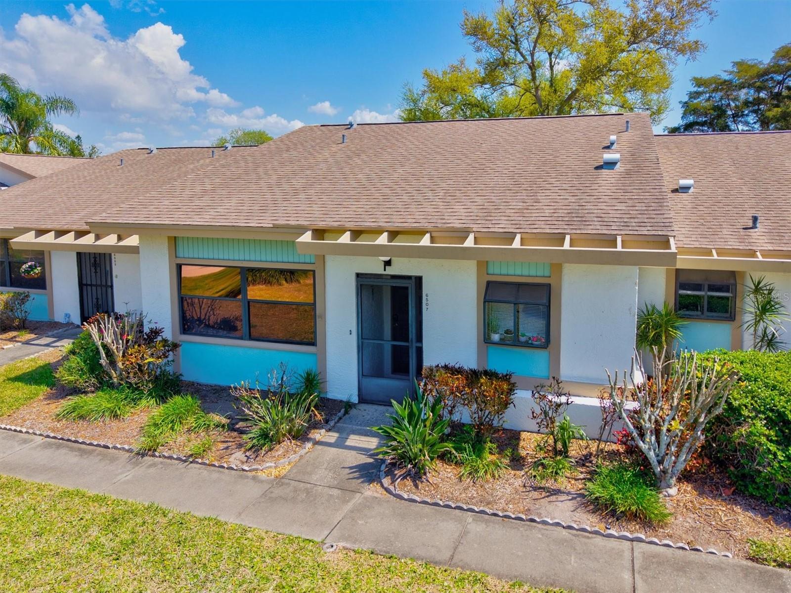 Welcome to effortless Florida living in the highly desirable Meadowcroft South community! This meticulously maintained 2-bedroom, 2-bath residence offers an exceptional blend of comfort, natural light, and serene waterfront views that truly set it apart. From the moment you enter, you’ll appreciate the bright and airy feel created by soaring vaulted ceilings and a skylight that fills the living and dining areas with beautiful natural light. The open-concept layout flows seamlessly into the eat-in kitchen, creating an inviting space ideal for both everyday living and entertaining. The true highlight of this home is the stunning 19x9 glass-enclosed lanai—your private retreat overlooking tranquil water and lush tropical surroundings. Whether you’re enjoying your morning coffee or unwinding with an evening beverage, this peaceful setting delivers the perfect backdrop for relaxed Florida living. Ideally located in the heart of West Bradenton, Meadowcroft South offers convenient access to GT Bray Park, Blake Medical Center, shopping, dining, and the world-renowned beaches of Anna Maria Island. Residents enjoy a vibrant yet relaxed lifestyle with optional social events, happy hours, and amenities that cater to both active and laid-back living. If you’ve been searching for a move-in-ready home with captivating water views and an unbeatable location, this is one you won’t want to miss. Schedule your private showing today!