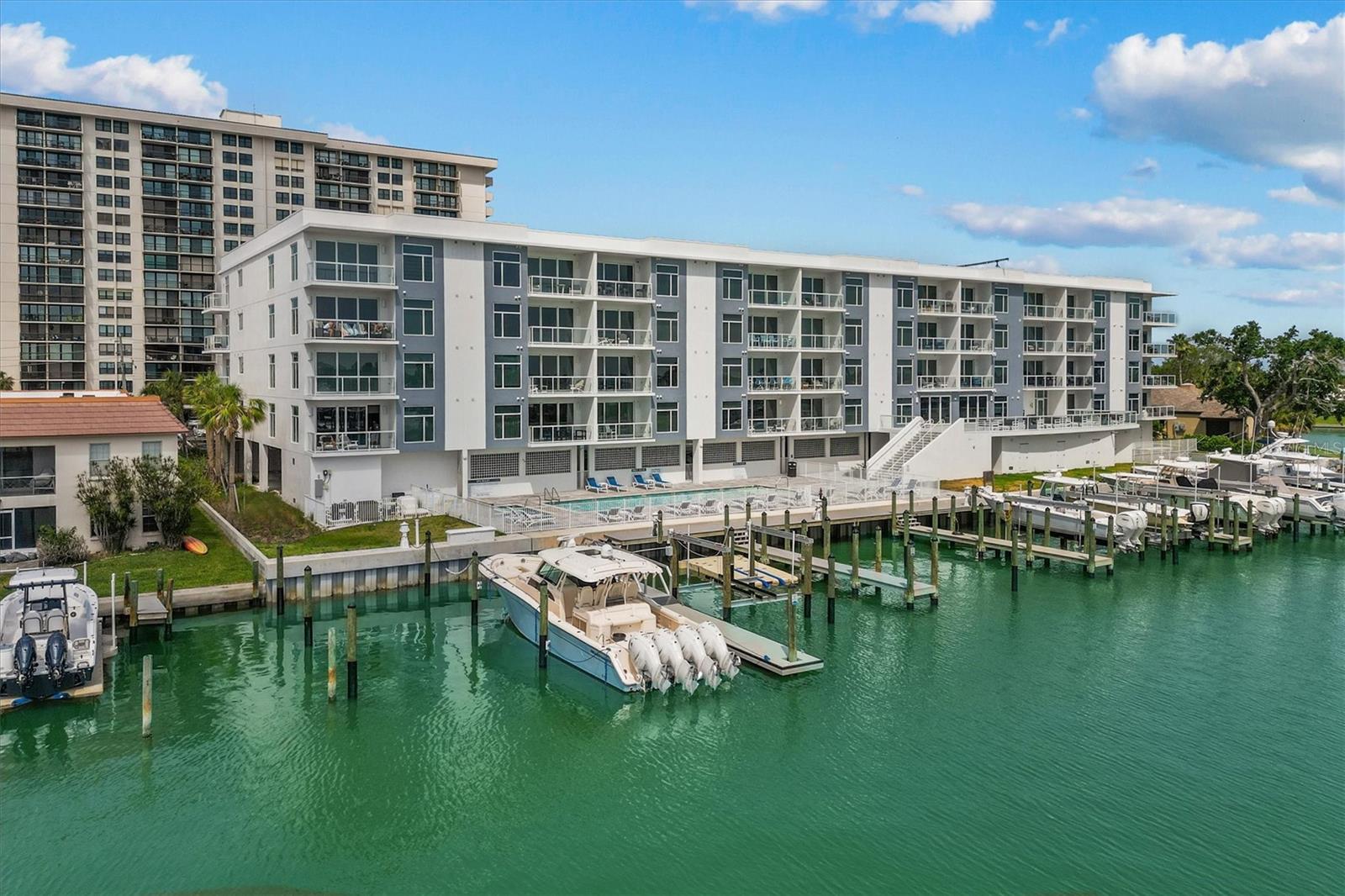 Welcome to one of the most sought-after waterfront communities in Island Estates, perfectly positioned just moments from the world-famous sugar-sand beaches of Clearwater Beach. Enjoy unparalleled convenience with restaurants, shopping, a marina, and a grocery store just steps away, plus endless coastal attractions right around the corner.

Completed in 2023, this premier luxury condominium community offers the peace of mind that comes with newer construction, eliminating concerns about aging roofs, HVAC systems, windows, or major capital improvements for years to come.

Nestled along the waterfront, the community features stunning shoreline views, exceptional craftsmanship, and an impressive collection of resort-style amenities. Residents enjoy a state-of-the-art fitness center, a classy and convenient meeting room with billiards, glass balconies designed to maximize views, and a spectacular waterfront social deck perfect for entertaining, grilling, relaxing, and taking in breathtaking sunsets over the bay. The community is also pet-friendly, making it easy to enjoy the Florida lifestyle with your furry companions.

This particular residence is being offered completely turnkey, with classy finishes around every corner, and showcases numerous upgrades throughout, including coveted automatic window treatments that add both convenience and sophistication. Simply arrive and start enjoying the luxury coastal lifestyle from day one.

What truly sets this community apart is the lifestyle. Spend your days boating, exploring Clearwater Beach, dining at waterfront restaurants, watching dolphins play in the bay, or enjoying unforgettable Florida sunsets. For boating enthusiasts, a private boat slip is available for separate purchase, providing direct access to Clearwater Bay and the Gulf of Mexico.

Whether you're seeking a primary residence, seasonal escape, or luxury coastal retreat, this exceptional Island Estates community delivers the perfect combination of location, lifestyle, and low-maintenance waterfront living.