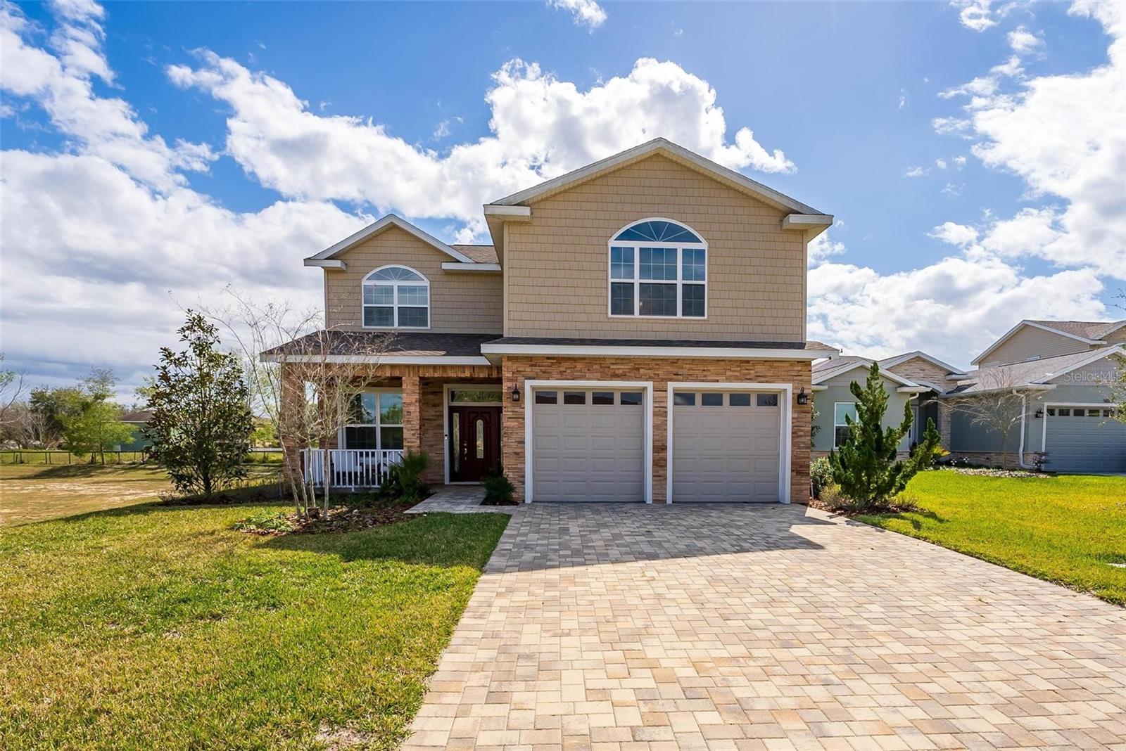 A must see this charming property nestled in the tranquil town of Oxford, Florida. This delightful home offers a perfect blend of comfort, style, and functionality. Upon arrival, you'll be greeted by a well-manicured lawn and inviting curb appeal. The exterior features a classic design with a spacious driveway and a two-car garage, providing ample parking space for residents and guests alike. Step inside, and you'll discover a warm and inviting interior with an abundance of natural light. The open-concept layout seamlessly connects the living spaces, creating an ideal environment for both relaxation and entertainment. The living room is the heart of the home, boasting high ceilings, elegant flooring, perfect for cozy evenings with loved ones. The kitchen is a chef's dream, equipped with modern appliances, ample cabinet space, and a convenient breakfast bar. Whether you're preparing a gourmet meal or enjoying a casual snack, this kitchen is sure to inspire your culinary adventures. The property features four spacious bedrooms, including a luxurious master suite complete with a walk-in closet and a private ensuite bathroom. The additional bedrooms are generously sized and offer plenty of space for rest and relaxation. Outside, the backyard oasis awaits, offering a peaceful retreat from the hustle and bustle of everyday life. Enjoy al fresco dining on the patio, soak up the sunshine in the lush garden, or simply unwind and enjoy the serene surroundings. Conveniently located near shops, restaurants, parks, and schools, this property offers the perfect combination of convenience and tranquility. Don't miss your chance to make this house your home and experience the best of Florida living.