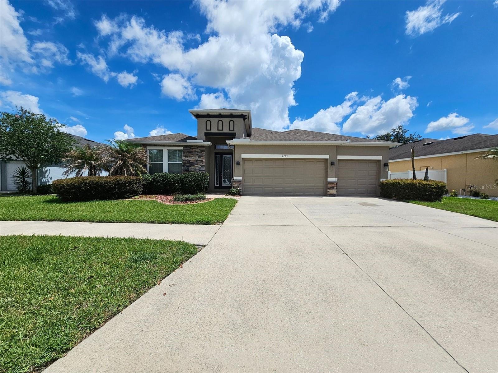 Welcome home to this spacious 3-bedroom, 3 bath, 3 car garage! Home features Laminate flooring & ceramic tile, an open concept kitchen/living/dining that is perfect for entertaining! Kitchen and Bathrooms have granite counter tops. All stainless-steel appliances in kitchen. Master has an enormous closet. You can work from home in your office located in the front of the home or use this room as a playroom. Secondary bedrooms are large, one with a walk-in closet, Inside Laundry room has cabinets, big closet & sink. TANKLESS Insta-Hot gas water Heater. Enjoy your coffee on the screened lanai. Backyard is fully fenced. Conveniently located minutes to shopping, restaurants, and major roads. EASY Access to I-4, I-75, and the Crosstown Expressway!
