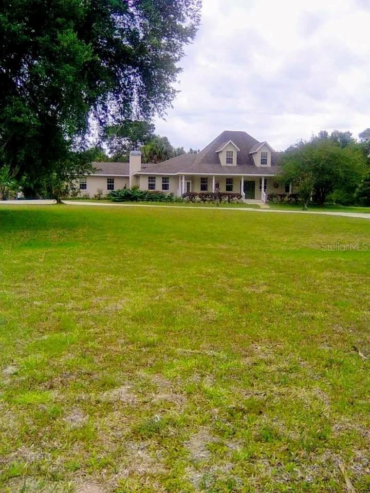This expansive two-story modern home has 4 bedrooms, 4.5 bathrooms and sits on 4.84 acres of peace and privacy. Only minutes from down Crystal River, restaurants, shopping. and Three Sisters Springs.  * 2-car garage * Storage Galore with several walk-in closets * Public water and well water for irrigation * Upstairs laundry chute * Agricultural exception lowers property taxes 80% * No HOA * Roof 7 years old * Main floor primary bedroom with walk-in closet and sitting room * Full Bathroom off the lanai * Oversized two car garage * Two large sheds and Commercial greenhouse * Schedule your private tour today!