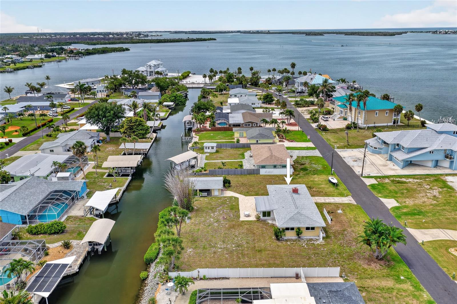 SAILBOAT WATERFRONT LIVING JUST MINUTES FROM LEMON BAY! Opportunity awaits at this 3 BEDROOM, 2 BATHROOM WATERFRONT HOME ideally located in one of Englewood's most desirable boating areas. With DIRECT SAILBOAT ACCESS and no bridges to navigate, you'll enjoy quick trips to Lemon Bay, the Intracoastal Waterway, and the Gulf of Mexico, making this a true boater's paradise.

Situated along a peaceful canal, the property features OVER 100 FEET OF CONCRETE SEAWALL and a PRIVATE BOATHOUSE WITH BOAT LIFT, providing exceptional space and convenience for storing your vessel and enjoying life on the water. Whether you're heading out for a day of fishing, island hopping, or watching spectacular Florida sunsets by boat, this location makes it all possible.

Inside, the home offers a bright and inviting layout with plenty of natural light throughout. The spacious living area serves as the heart of the home and features a charming fireplace feature, creating a warm and welcoming atmosphere for family gatherings or quiet evenings at home. Large windows help bring the outdoors in while showcasing the home's light and airy feel.

The kitchen offers ample cabinetry, NEW STAINLESS STEEL APPLIANCES, and a functional layout that makes meal preparation and entertaining easy. The three-bedroom floor plan provides flexibility for family, guests, or a home office, while two full bathrooms offer convenience and comfort.

One of the home's standout features is the LARGE FLORIDA ROOM, providing valuable additional living space that can be used as a second family room, game room, hobby area, home office, or the perfect place to relax and enjoy views of the surrounding property year-round.

Additional updates include a NEW ROOF and A/C REPLACED IN 2025, providing added peace of mind for years to come. The property also features a ONE-CAR GARAGE, durable tile flooring throughout much of the home, and a layout designed for easy Florida living.

Adding even more value, the OVERSIZED LOT AND ZONING ALLOW FOR THE POSSIBILITY OF A DETACHED GARAGE OR DETACHED GUEST HOUSE (buyer to verify all requirements with local authorities), creating exciting opportunities for future expansion.

Location is everything, and this property delivers. Situated just a short distance from ENGLEWOOD BEACH, you'll enjoy easy access to beautiful Gulf waters, waterfront dining, shopping, entertainment, and all the recreational opportunities that make Southwest Florida such a sought-after destination.

Whether you're searching for a year-round residence, seasonal retreat, or waterfront investment opportunity, this property offers the chance to create your ideal coastal lifestyle in an unbeatable location.

BRING YOUR BOAT, YOUR VISION, AND YOUR LOVE FOR THE WATER—THIS ENGLEWOOD WATERFRONT GEM IS READY FOR ITS NEXT CHAPTER!
