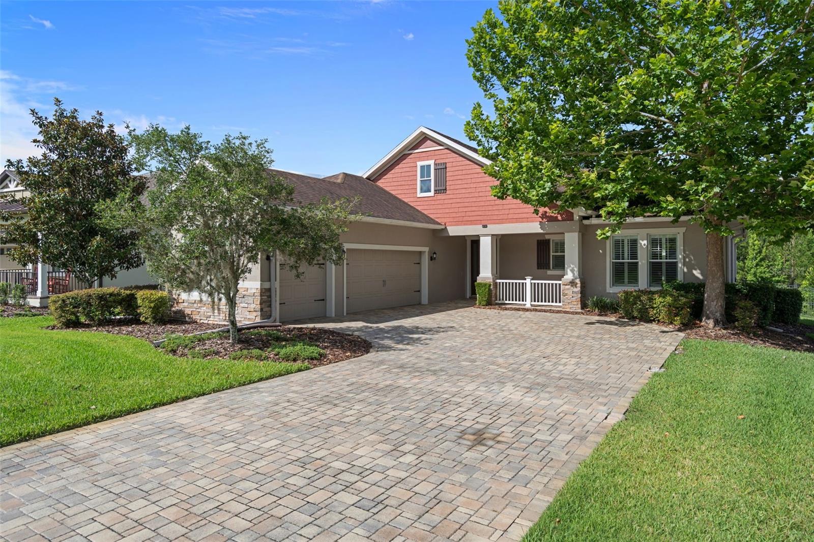 Experience low-maintenance luxury living in the highly sought-after Manors of Southern Hills Plantation! This beautifully maintained 3-bedroom, 2-bath home offers 2,082 living sq ft with a thoughtfully designed split floor plan and quality finishes throughout. From the moment you step inside, you’ll notice crown molding, plantation shutters, elegant trim details, and fresh interior paint creating a polished, move-in-ready feel. The heart of the home is the spacious chef’s kitchen, featuring rich wood cabinetry, granite countertops, stainless steel appliances, a gas range, under-cabinet lighting, a pantry, abundant storage, and a large island with bar seating—perfect for entertaining or everyday living. The open-concept design flows seamlessly into the main living area with high ceilings, enhancing the spacious feel.
Just off the garage entry, you’ll find a built-in drop zone area with granite counter and cabinetry, offering the perfect space for everyday organization. Nearby, the oversized laundry room provides even more functionality with a large walk-in storage closet. 
The private primary suite features a tray ceiling, peaceful backyard views, and a spacious ensuite bath. Step outside to the expansive screened brick paver lanai overlooking a fenced backyard and tranquil views, creating a private outdoor retreat with no rear neighbors.
Additional highlights include a paver driveway, golf cart garage space, and a new HVAC (2025) with UV light. The HOA covers exterior paint, lawn care, mulch, irrigation, and cable/internet, making it easy to enjoy the low-maintenance luxury lifestyle Southern Hills is known for.

Located in the gated, resort-style community of Southern Hills Plantation, with optional golf memberships available, this home offers the perfect blend of comfort, convenience, and scenic privacy.