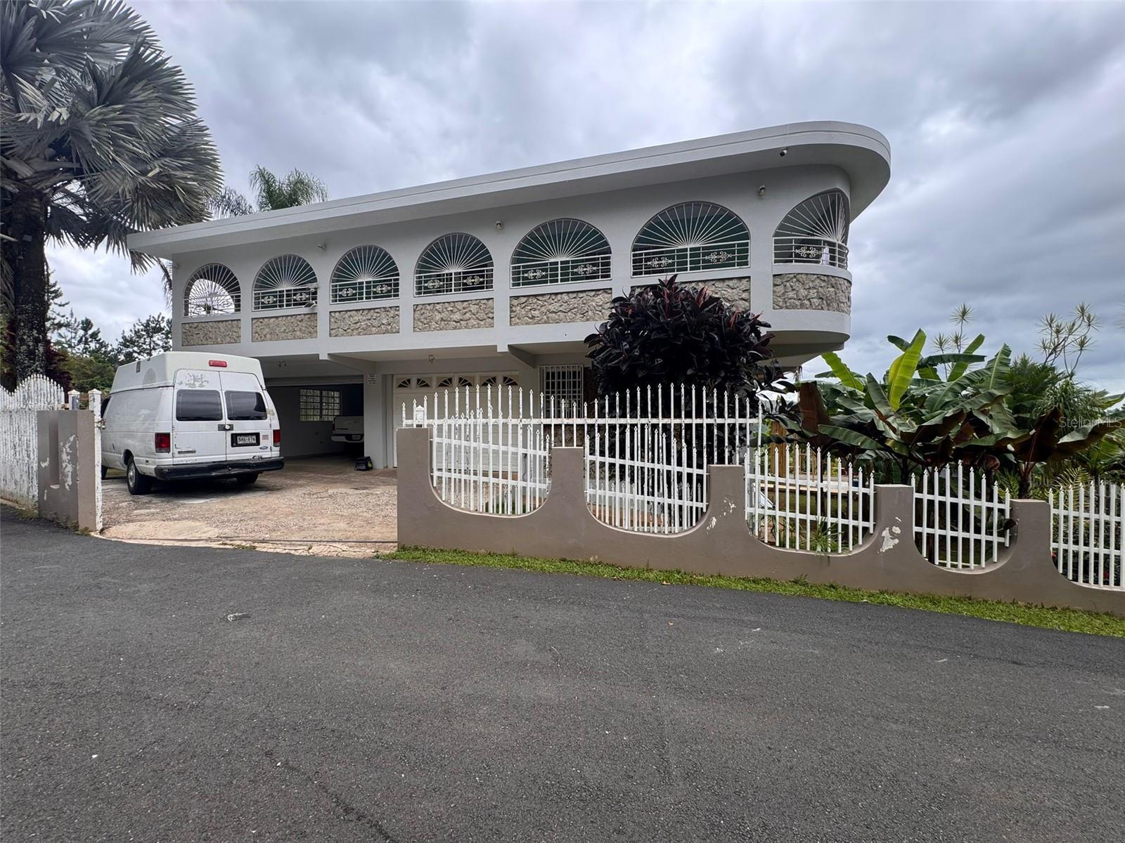 Mountain living, tranquility, and comfort come together in this beautiful country-style property located in Los Pinos Farms, Orocovis, Puerto Rico.

The property features 3,641 square meters of land surrounded by lush vegetation, breathtaking panoramic mountain views, and a private, relaxing atmosphere.

The residence offers approximately 1,728 square feet of living area with 3 bedrooms and 2 bathrooms. The master bedroom includes its own private bathroom and a private balcony overlooking the mountains.

The interior spaces feature abundant natural light, spacious living and dining areas, a functional kitchen, and an extensive covered balcony with elegant arches and scenic views of nature.

The outdoor areas are perfect for enjoying time with family and friends, featuring a covered terrace, above-ground pool, and multiple spaces to relax while enjoying the cool climate of Orocovis. The property also includes tropical gardens and beautifully maintained green areas.

One of the property’s greatest highlights is its enormous garage with a separate laundry room, offering ample space for multiple vehicles, motorcycles, storage, a workshop, or recreational projects.

No HOA.