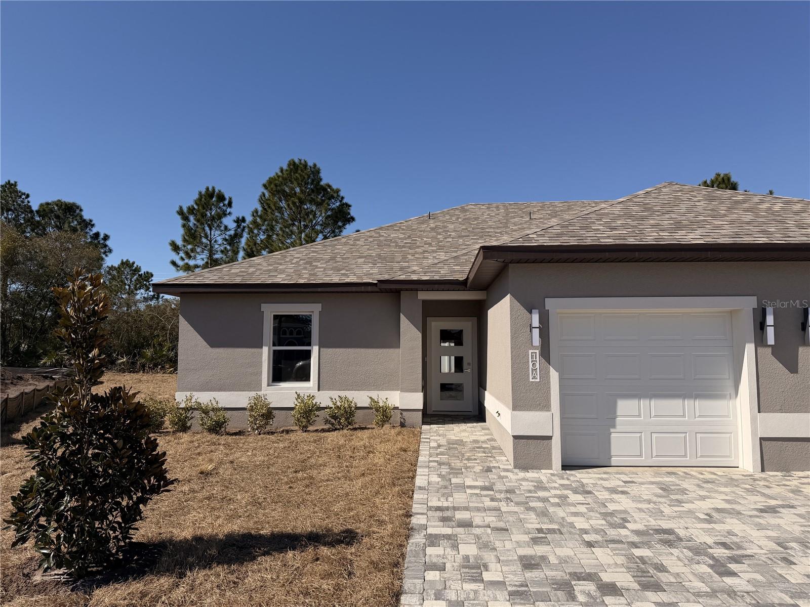 2026 year build, 1200 sqft 3-bedroom, 2-bathroom duplex unit is located in Matanzas Woods Subdivision. Crafted with meticulous attention to detail by the builder, this property offers a unique blend of comfort and style. The kitchen features stainless steel energy-efficient appliances, elegant granite countertops, and 42-inch cabinets. The master shower and guest bath are adorned with tile that extends all the way to the ceiling, adding a touch of sophistication to your daily routine. The house boasts waterproof, scratchproof luxury vinyl planks throughout, combining beauty and durability to withstand the test of time. Each bedroom is equipped with ceiling fans featuring built-in lighting. Great location in the heart of the city, you won't be too far from necessities. Bike, walk, or stroll along the 4-mile walking sidewalk with benches. About than 15 minutes in the car, you'll be on the beautiful shore of Flagler Beach . Only 20 minutes north of historic downtown St. Augustine or 30 minutes south of The World's Most Famous Daytona Beach