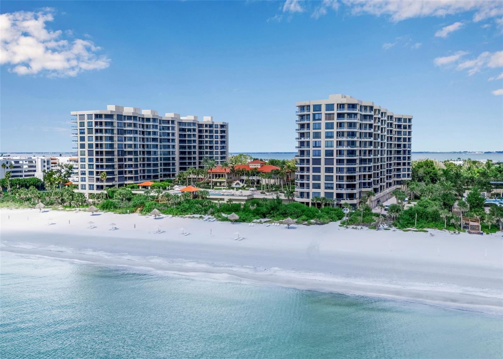 Live the lavish lifestyle only found at the Water Club on Longboat Key, an idyllic waterfront location with direct access to the white sand beaches only found along the aquamarine waters of the Gulf Coast. This exceptional, beautifully Thomas Moser furnished, 2-bedroom, 2.5-bathroom split plan features spacious en-suite bedrooms with privacy, 10-foot ceilings, floor-to-ceiling hotel-quality hurricane impact windows & sliders, Brazilian Cherry Wood floors, a lovely and convenient powder bath and an incredible master suite with generous walk-in closet and direct access to the private balcony. The masterfully remodeled kitchen showcases custom cabinetry, glass mosaic backsplash, a reverse osmosis faucet, stainless-steel appliances including a Viking stove, Sub-Zero refrigerator and separate dry bar with Sub-Zero wine and beverage refrigerators. Step out onto the extra-large terrace and enjoy the beautiful privacy of the surrounding tropical foliage. Located on the plaza level, you will have quick and easy access to world-class community amenities like 24-hour guard-gated security, full concierge service, a resort-style pool and spa, Har-Tru tennis courts, fitness center, clubhouse with catering kitchen, and over 16 acres of pristine beachfront grounds. Experience the Water Club...timeless elegance, modern design, and a lifestyle beyond compare. Located a short distance from St. Armands Circle and Downtown Sarasota’s culture, shopping and fine dining.