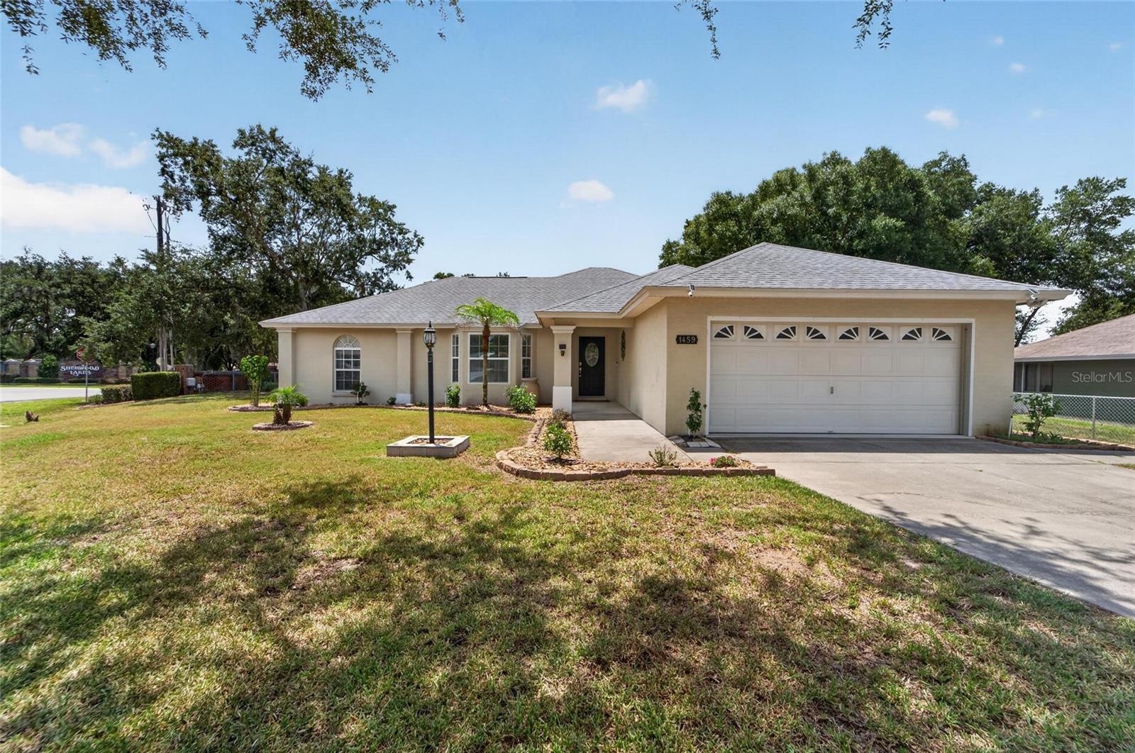 Corner lot charm meets low-maintenance living in this well-appointed 3-bed, 2-bath ranch tucked inside Wellington Green, one of Lakeland's most established and quietly sought-after HOA communities with low dues and no CDD fees.
Built in 2004 this 1,591 sq.ft. split-bedroom floor plan offers real wood flooring throughout the main living areas, dining room built in with lots of cabinets, and a new roof (2022) that gives buyers the confidence they're looking for. The kitchen features a new refrigerator and dishwasher, making move-in truly effortless.
Step outside and fall in love with the outdoor living this home delivers, a generous 10×40 screened porch perfect for entertaining or your morning workouts overlooks a fully fenced backyard filled with mature landscaping and producing fruit trees. The included storage shed almost brand new adds even more practicality to this .35-acre corner lot.
Located just minutes from shopping and dining along Kathleen Road, schools, parks, and with easy access to major corridor,  this home checks every box for convenience without sacrificing the quiet, neighborly feel of Wellington Green.
No flood zone. Public water. TECO electric. Cable & internet available.
This one has the upgrades, the space, and the setting. Come see it before it's gone.