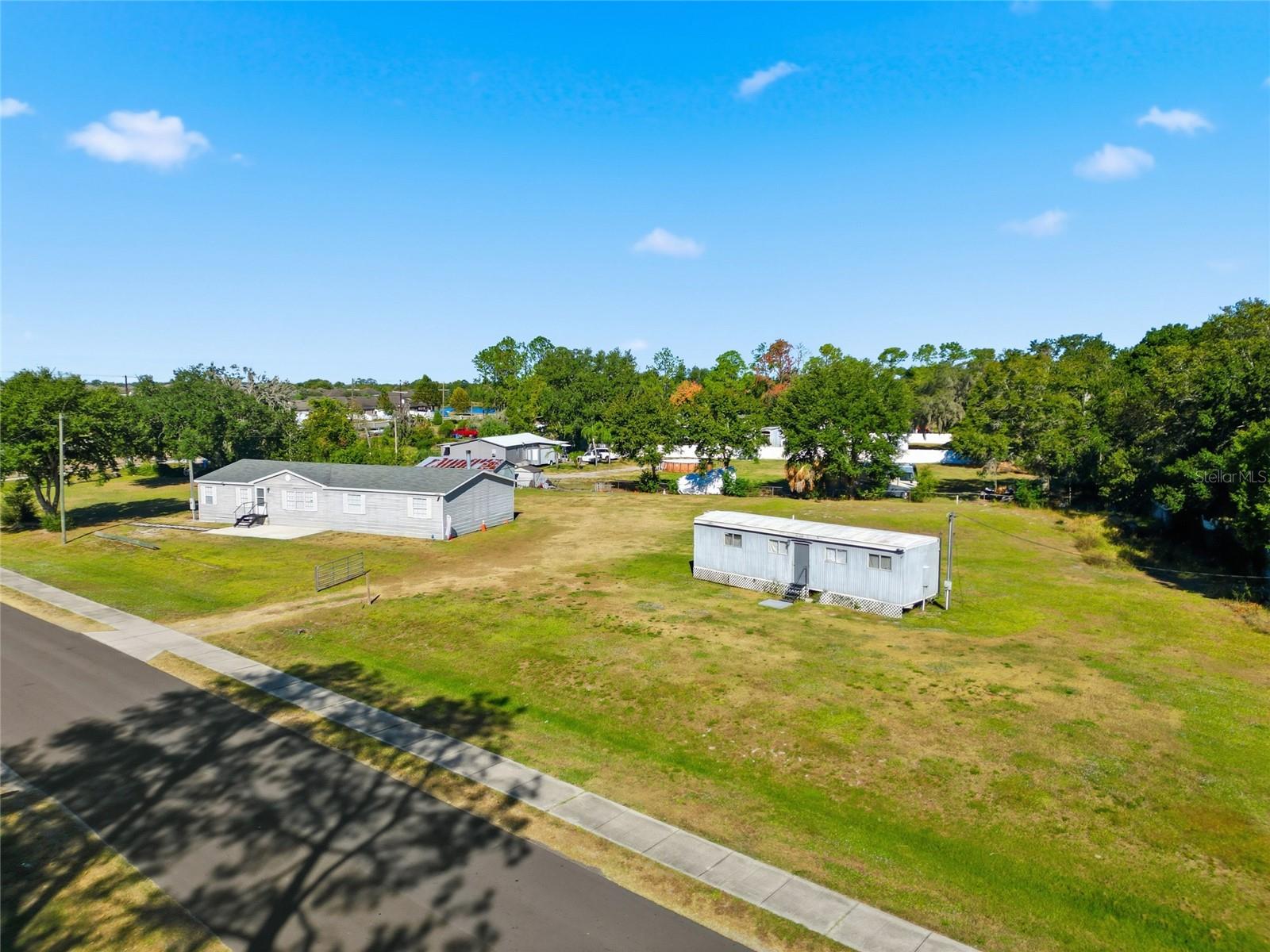 One or more photo(s) has been virtually staged. Prime Location in Hillsborough County!
Nestled within an established neighborhood, this 1.17-acre corner lot at 12422 Balm Riverview Rd presents a unique opportunity to invest in one of Riverview’s most dynamic areas. The 2,322 sq. ft. manufactured structure sits on a beautifully maintained property, perfectly positioned for both work and leisure.

Located just minutes from the vibrant Tampa Bay area, you’ll enjoy convenient access to major dining, shopping, and entertainment destinations. The property’s central location offers excellent visibility and accessibility, making it ideal for a variety of uses. The seller is currently applying for rezoning to CN or mixed use, opening the door to exciting development possibilities.

With city water and septic already connected, this site is ready for its next phase—whether as an investment, a business venture, or a creative redevelopment project. Don’t miss the chance to own land in this fast-growing, high-demand corridor of Riverview, FL.