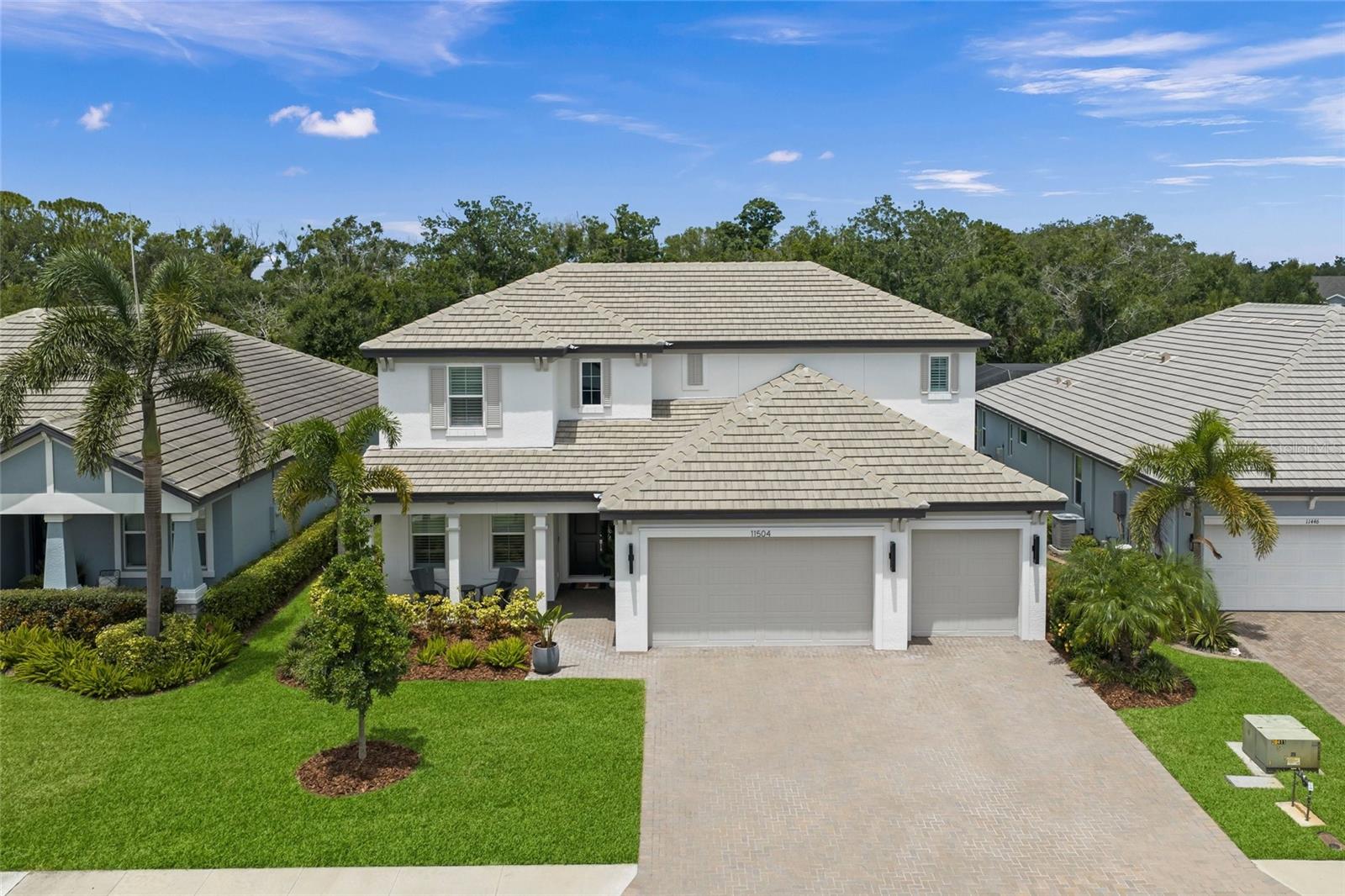 Extremely upgraded and modern, this spacious 5-bedroom, 4-bath home sits on a private preserve lot with a resident peacock, creating a setting that feels both elevated and memorable. Designed with high-end finishes, generous living spaces, and thoughtful details throughout, this home offers the kind of style, space, and privacy that stands out immediately.

Inside, the home is filled with elevated finishes and thoughtful upgrades, starting with a gourmet kitchen featuring a waterfall quartz island and quartz countertops, GE Cafe stainless appliances with range hood, gas cooktop, combination wall oven with convection and microwave technology, Kohler faucet package, single basin oversized undermount sink, custom walk-in pantry, soft-close drawers, and LED under-cabinet lighting. The primary suite offers a tray ceiling and custom walk-in closet, while the deluxe primary bath includes a rain shower head, dual vanities, an oversized step-in shower with built-in bench, quartz countertops, and a freestanding tub. All bathrooms include tile taken to the ceiling, upgraded wall-mounted mirrors, and upgraded light fixtures, with glass shower enclosure in the downstairs bath and tile accent walls in the primary bath, second bath downstairs, drop zone, and laundry room. Interior finishes include new engineered hardwood flooring, wood stairs, plantation shutters throughout, crown molding throughout, extensive custom millwork with oversized baseboards, wood door casings, applied panel molding, and wood-wrapped columns, plus a tongue-and-groove paneled accent wall in the dining room. Additional interior upgrades include high-end luxury chandeliers and pendant lighting throughout, ceiling fans in the bedrooms and loft, recessed lighting in every bedroom, a tray ceiling in the great room, 8-foot interior doors, and fresh interior and exterior paint. Outdoor and lanai features include a panoramic lanai screen, preserve lot with resident peacock, additional gas drop on the lanai, outdoor sink rough-in, holiday light package with electrical outlets in the soffit on either front corner of the home and on a timer in the garage, and a pavered driveway and lanai. Additional systems, storage, and smart home features include a gas tankless water heater, water filtration and softening system with soft-water loop, Safe Racks overhead garage ceiling storage, 60-amp electric vehicle charger, drop zone with custom cabinets, custom laundry room with plenty of additional storage, and a smart home package with doorbell camera, front and rear exterior cameras, and a wireless access point on the back lanai.

HOA fees include access to the community pool, playground, dog park, and pickleball courts. The location offers easy access to SR-64 and I-75, with Costco, shopping, dining, gyms, salons, and everyday conveniences nearby. Just a few blocks south are Lakewood Ranch schools including Gullett Elementary, Lakewood Ranch High School, and Mona Jain Middle School, along with LECOM and Manatee Technical College East Campus. You are also minutes from Downtown Lakewood Ranch, Waterside, SRQ International Airport, UTC shopping and dining, Ellenton Premium Outlets, and some of the top-rated beaches in the country.